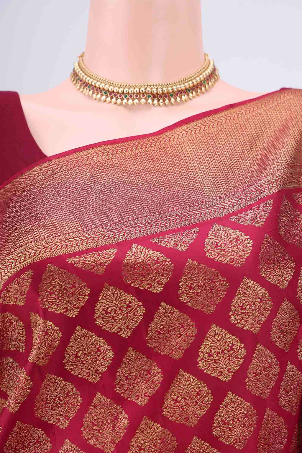 Border image of Maroon Kanjivaram Silk Saree with Zari Brocade on the body and Zari Border. 