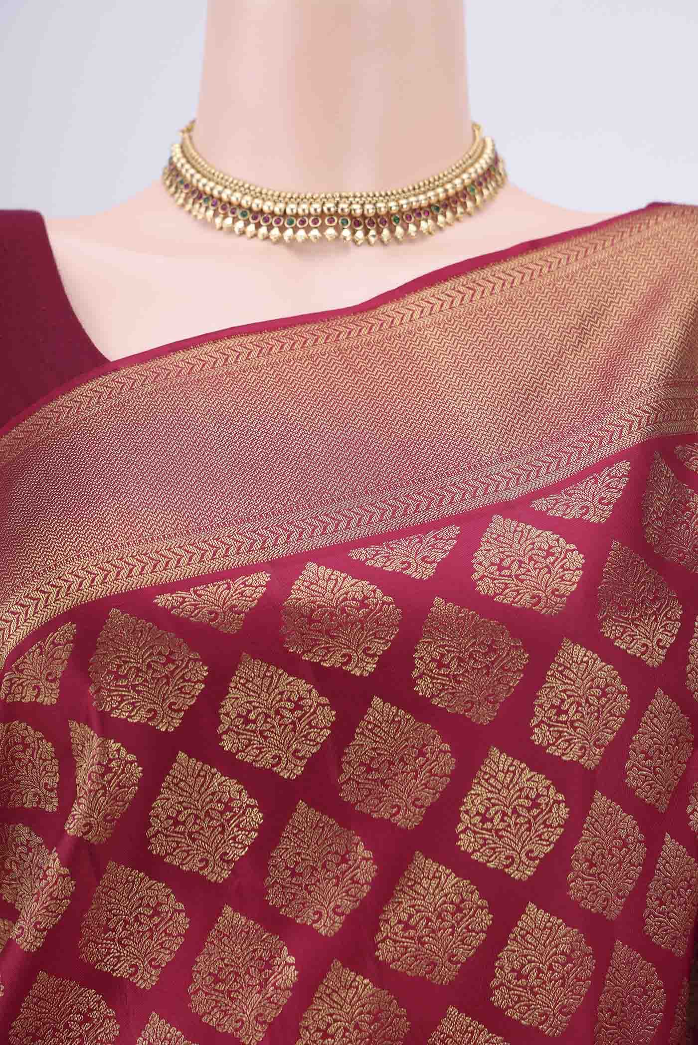 Border image of Maroon Kanjivaram Silk Saree with Zari Brocade on the body and Zari Border. 