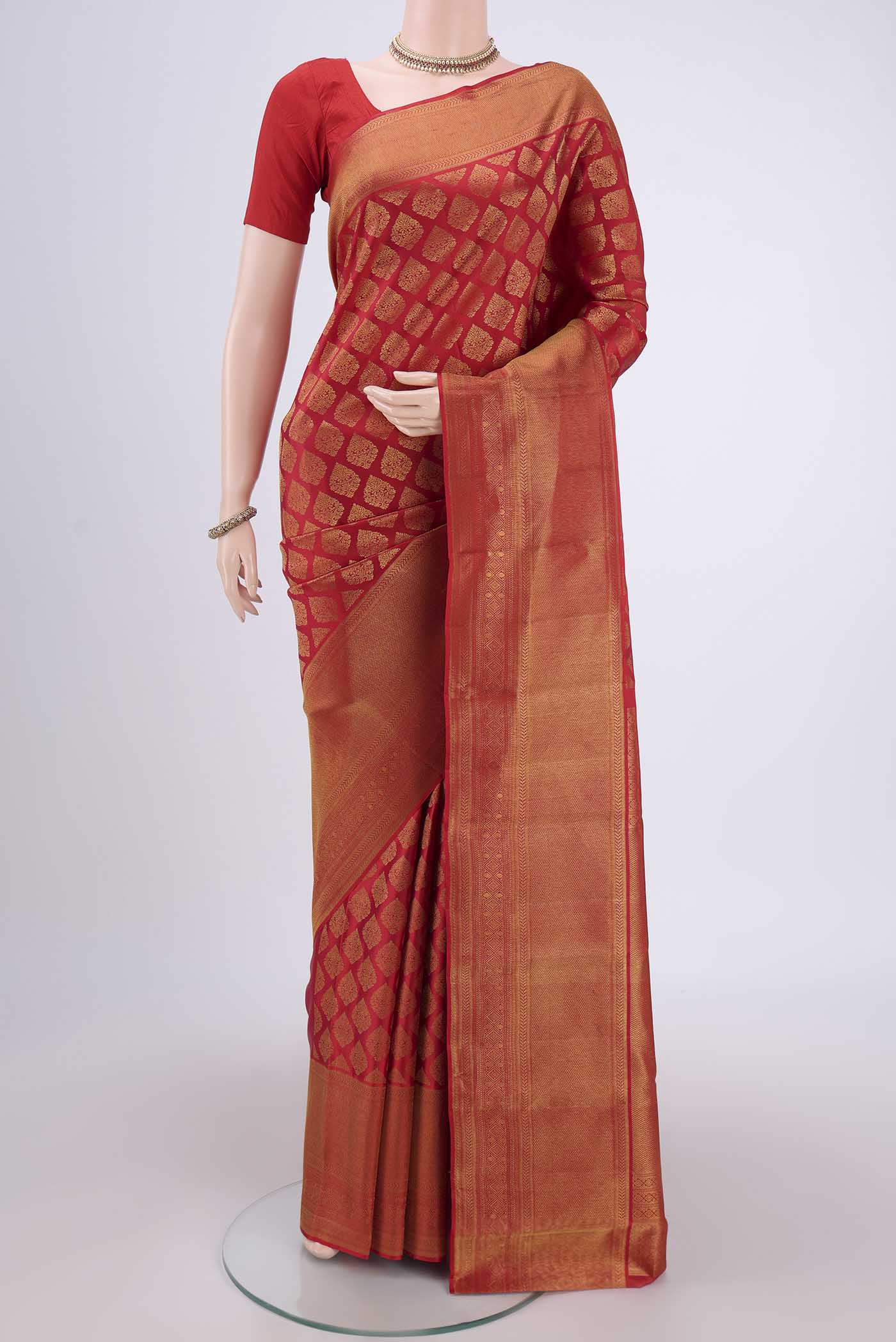 Red Kanjivaram Silk Saree with Zari Brocade on the body and Zari Border.  displayed on a mannequin
