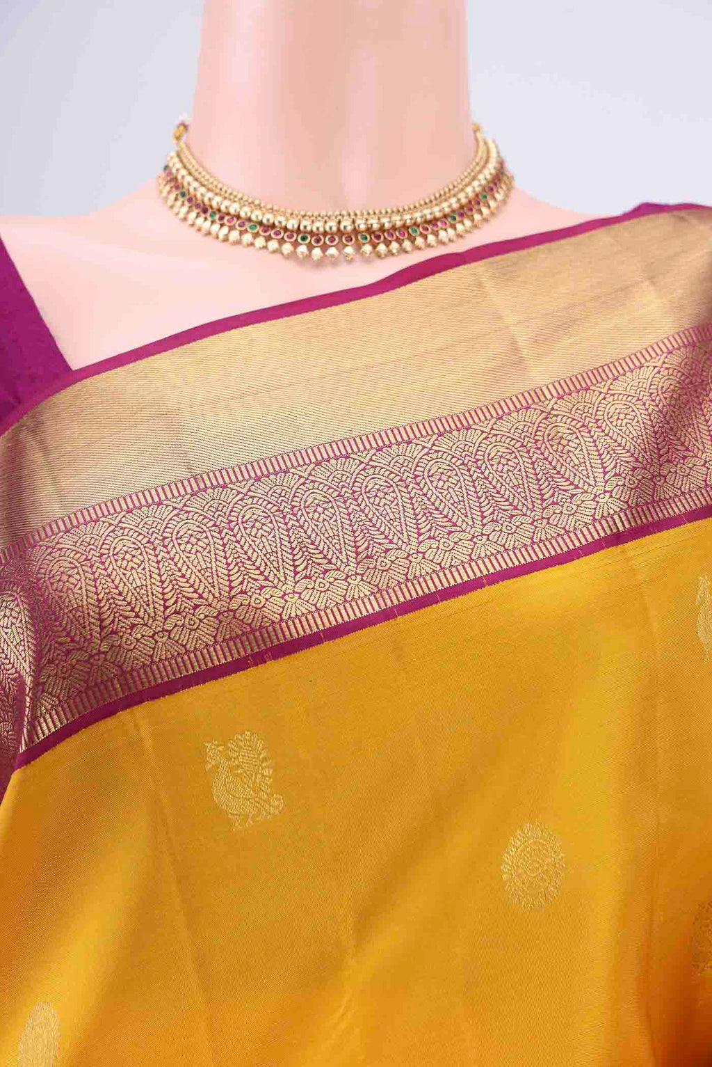 Border image of Yellow Kanjivaram Silk Saree with Zari Butta on the body and Zari Border. 