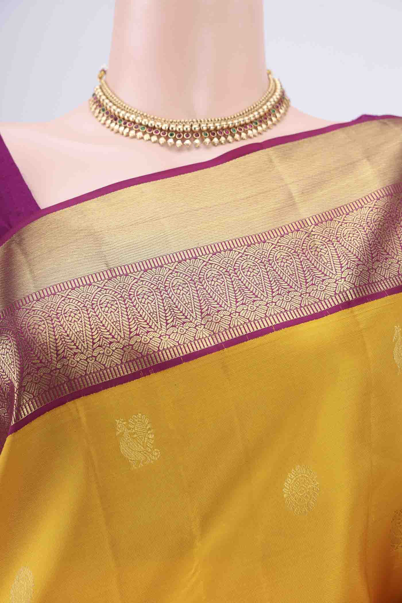 Border image of Yellow Kanjivaram Silk Saree with Zari Butta on the body and Zari Border. 