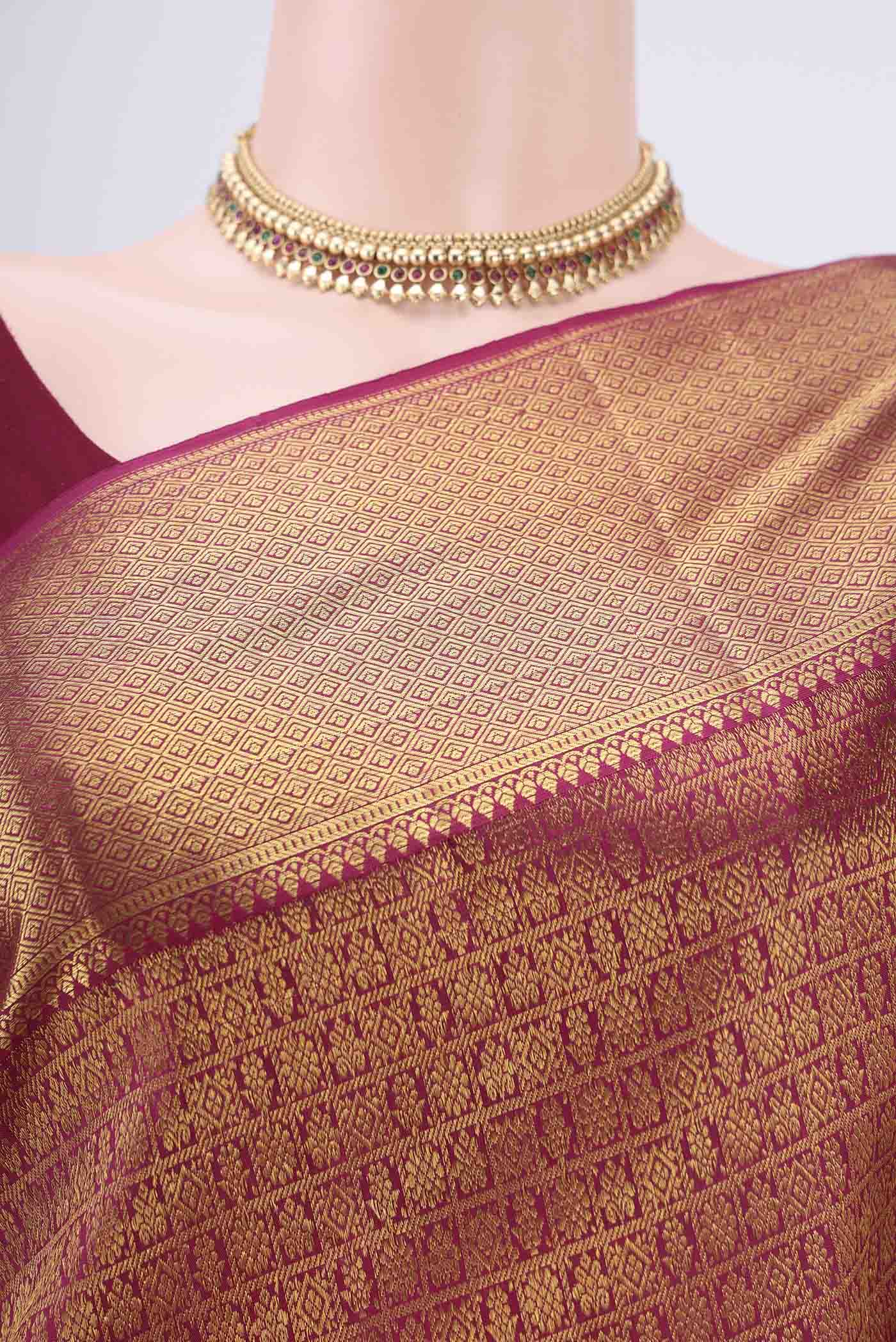 Border image of Magenta Kanjivaram Silk Saree with Zari Brocade on the body and Zari Border. 