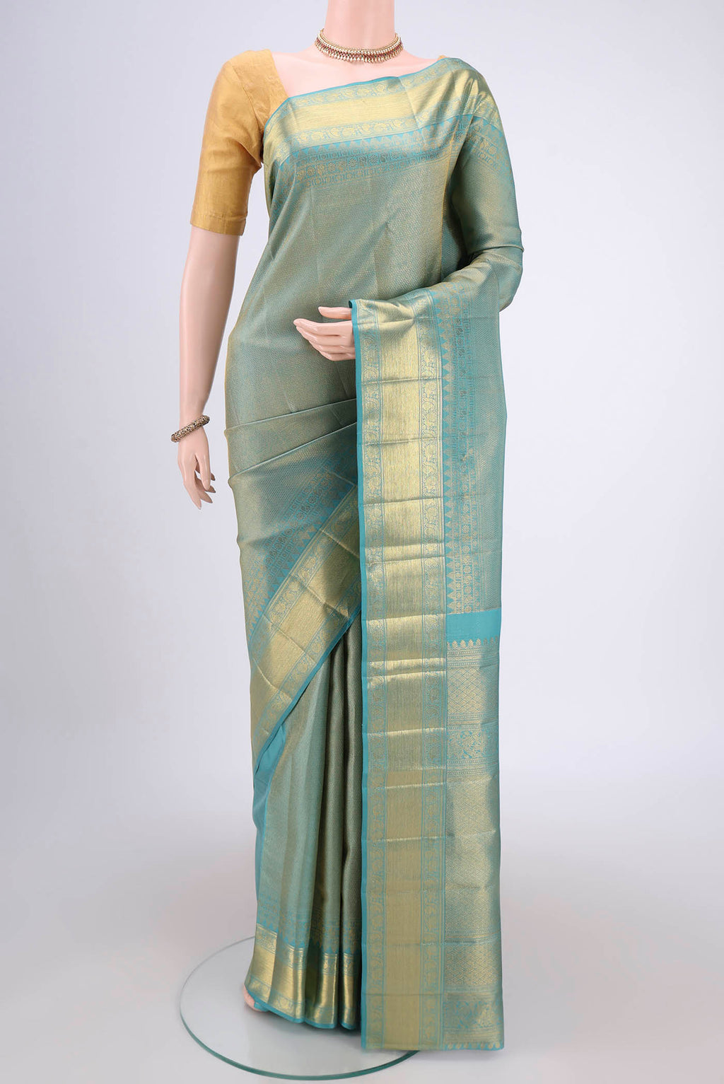 Maya Blue Kanjivaram Silk Saree with Zari Brocade on the body and Zari Border.  displayed on a mannequin