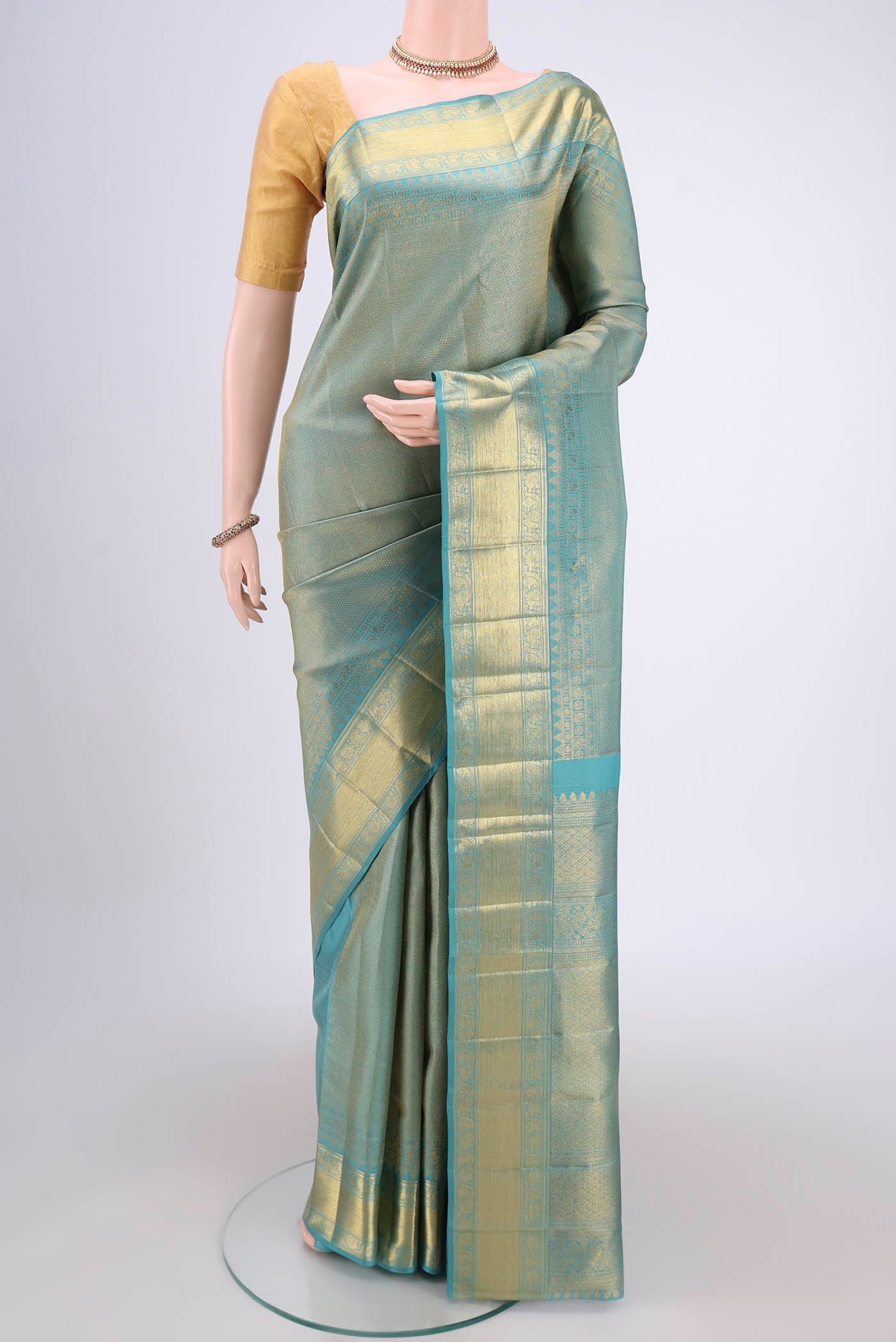 Maya Blue Kanjivaram Silk Saree with Zari Brocade on the body and Zari Border.  displayed on a mannequin