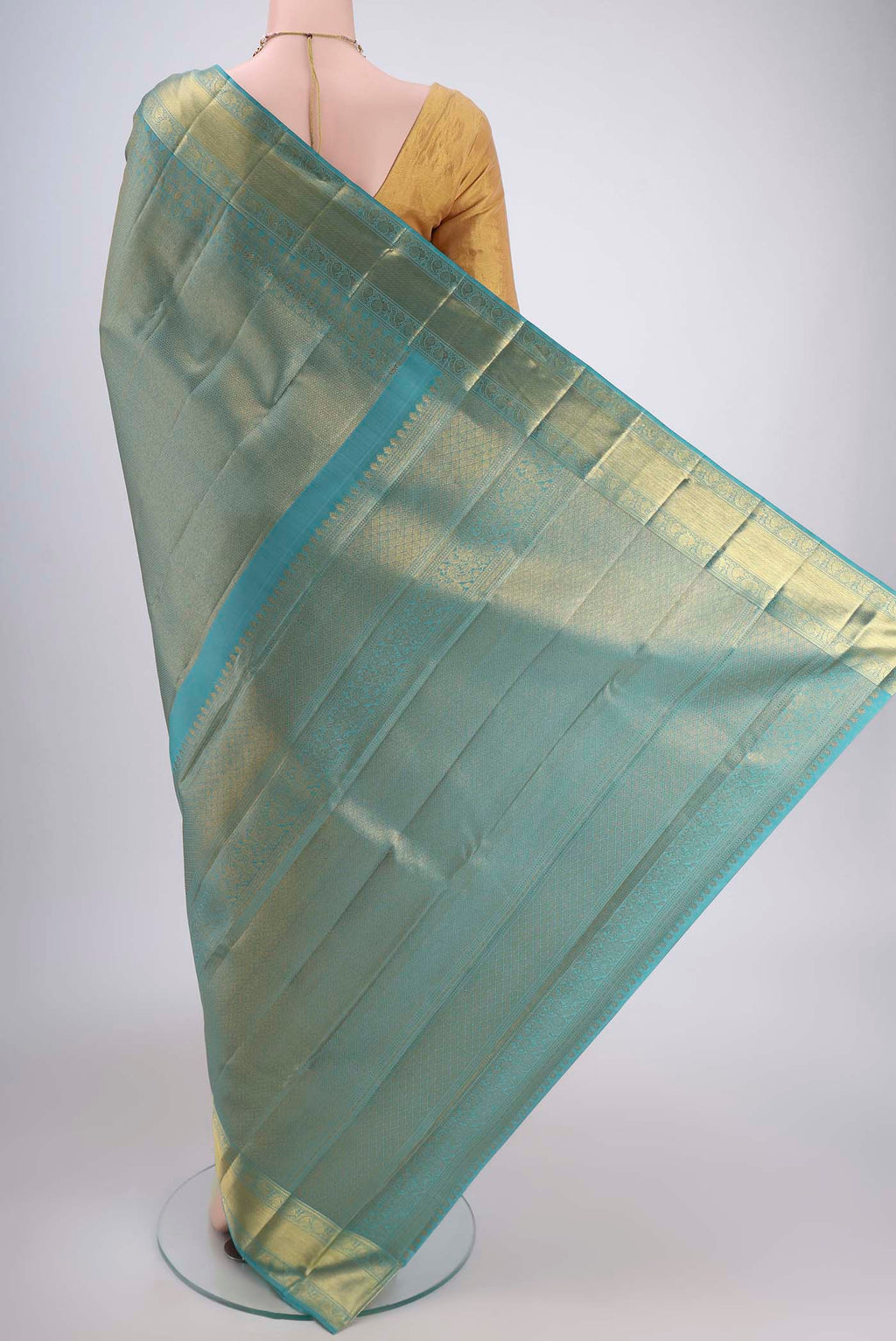 Flat view of Maya Blue Kanjivaram Silk Saree with Zari Brocade on the body and Zari Border. 