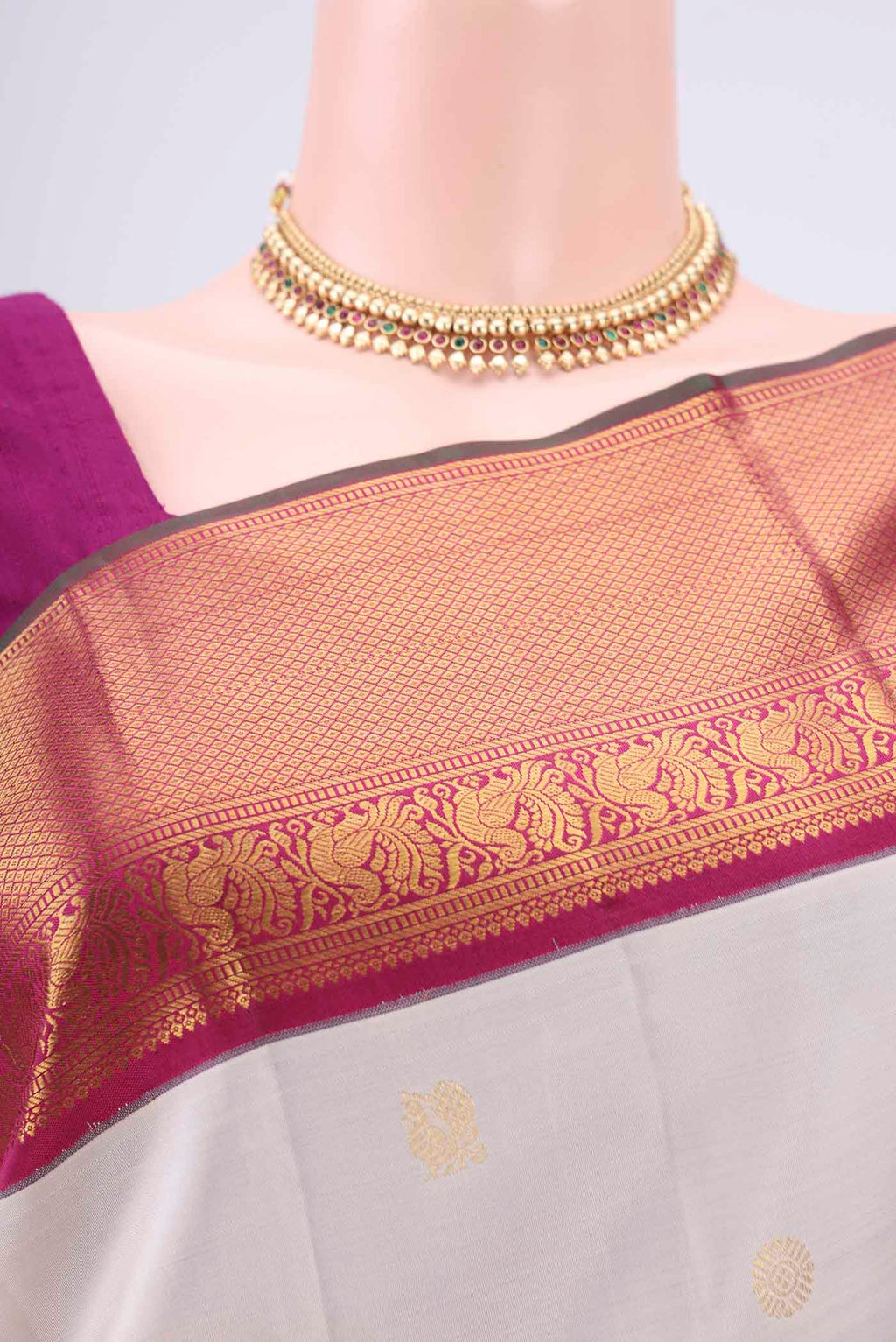 Border image of Off White Kanjivaram Silk Saree with Zari Butta on the body and Zari Border. 