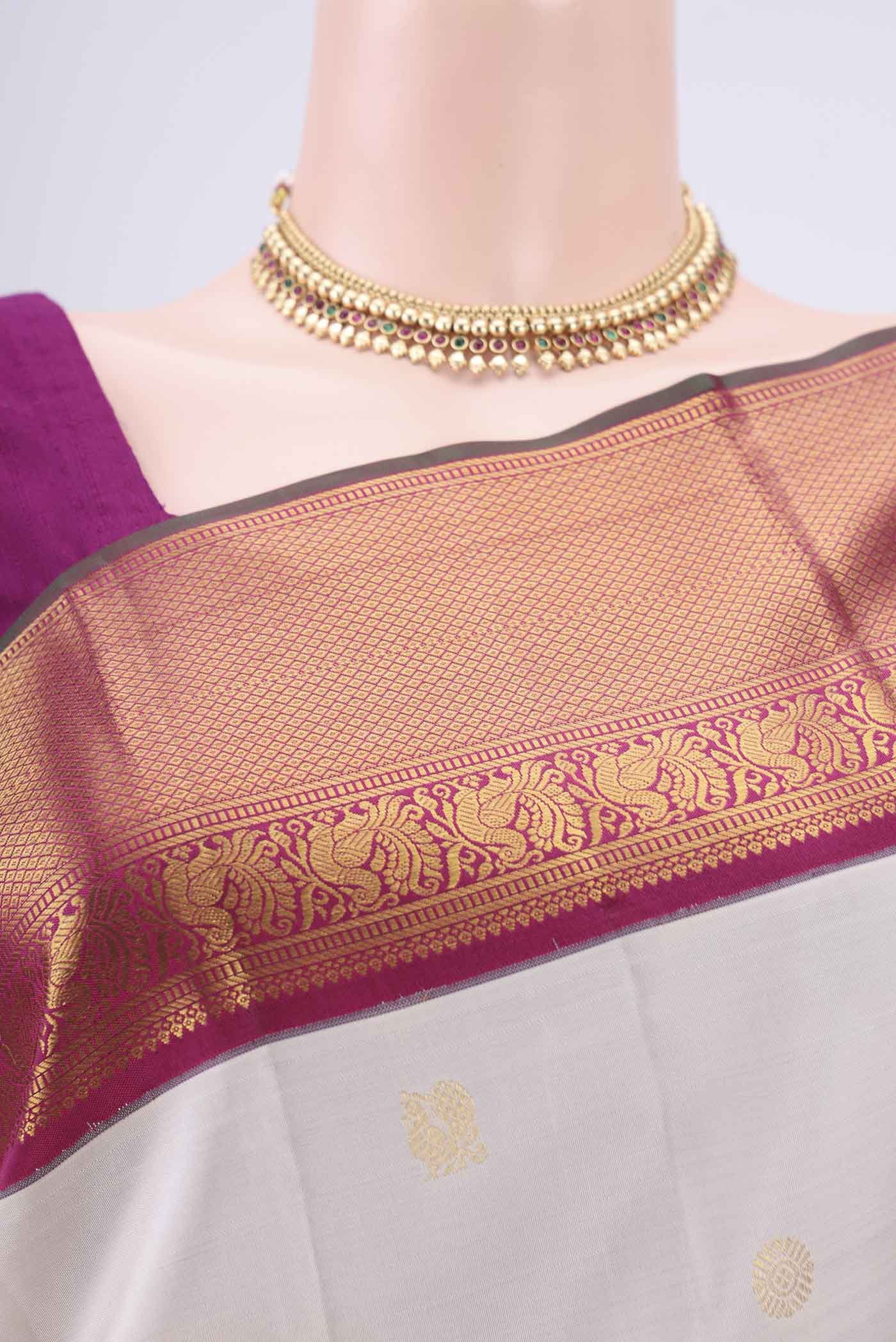 Border image of Off White Kanjivaram Silk Saree with Zari Butta on the body and Zari Border. 