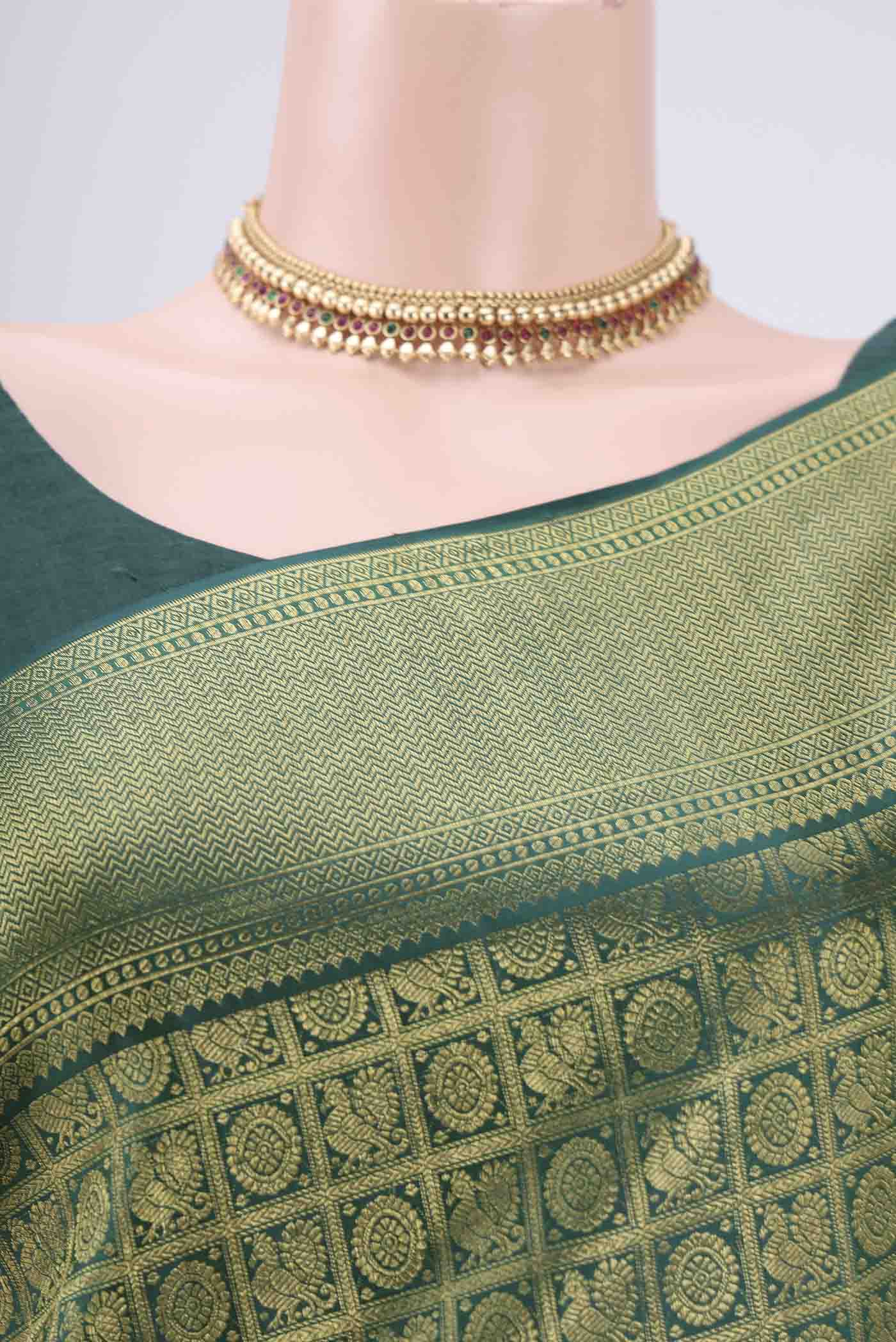 Border image of Bottle Green Kanjivaram Silk Saree with Zari Brocade on the body and Zari Border. 
