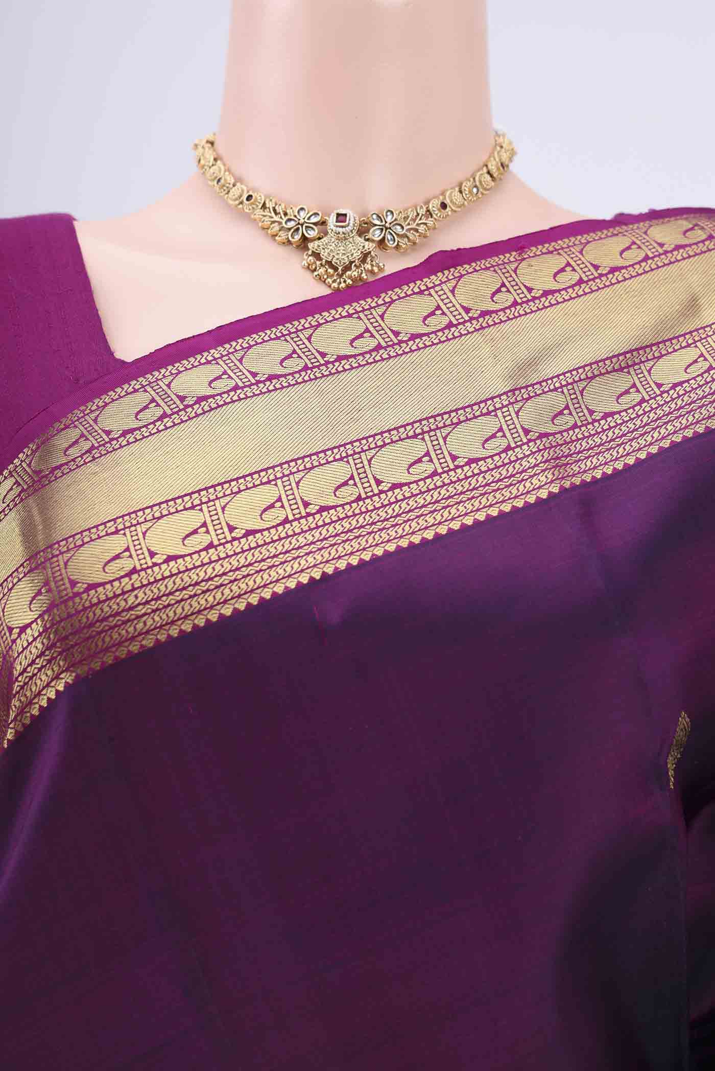 Border image of Purple Kanjivaram Silk Saree with Zari Butta on the body and Zari Border. 