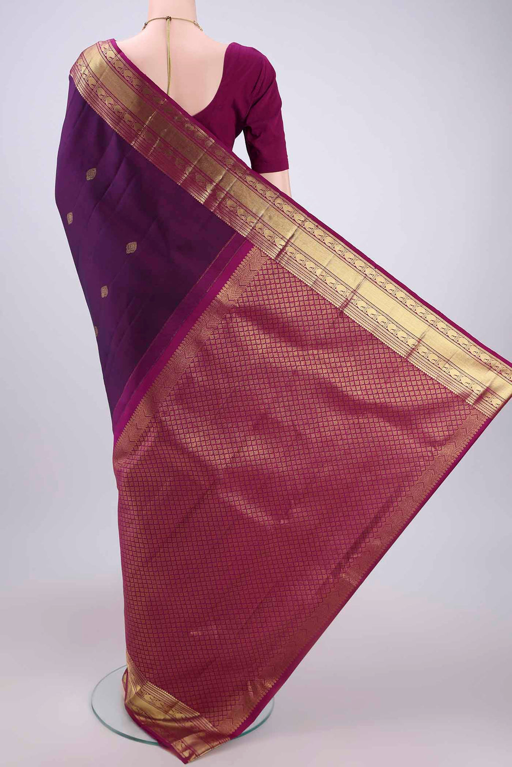Flat view of Purple Kanjivaram Silk Saree with Zari Butta on the body and Zari Border. 