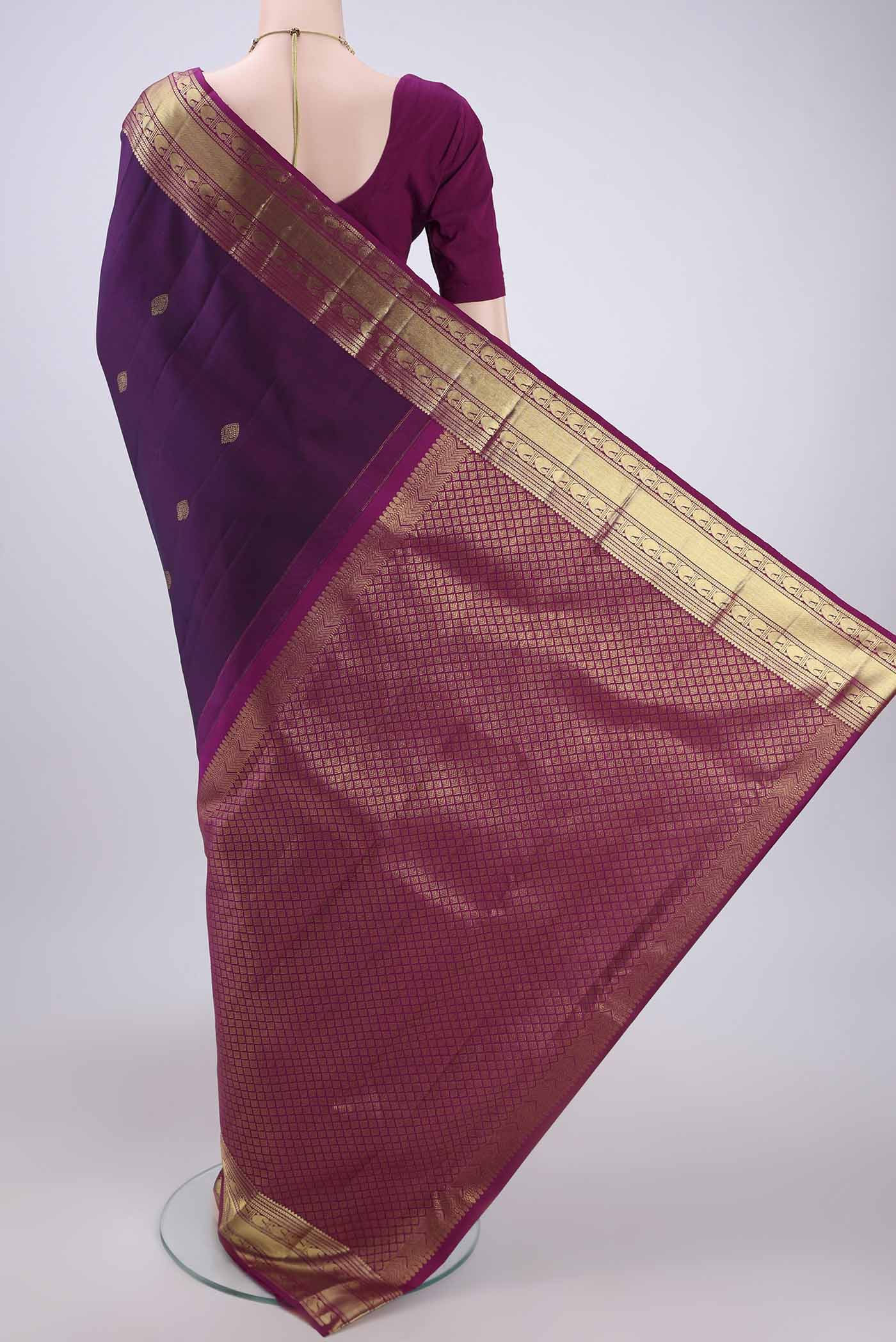 Flat view of Purple Kanjivaram Silk Saree with Zari Butta on the body and Zari Border. 