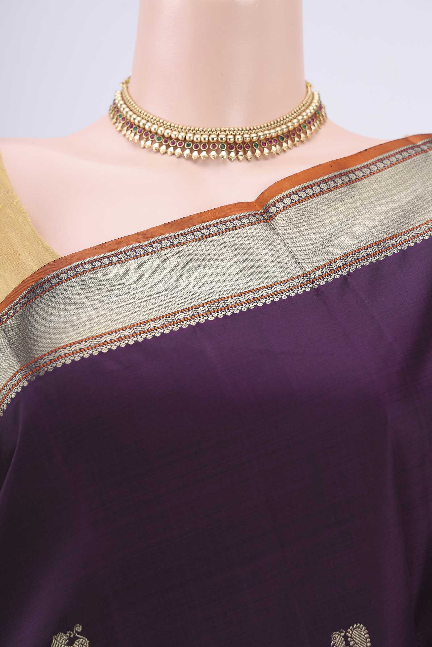 Border image of Purple Kanchipuram Silk Saree with Zari Butta on the body and Zari Border. 