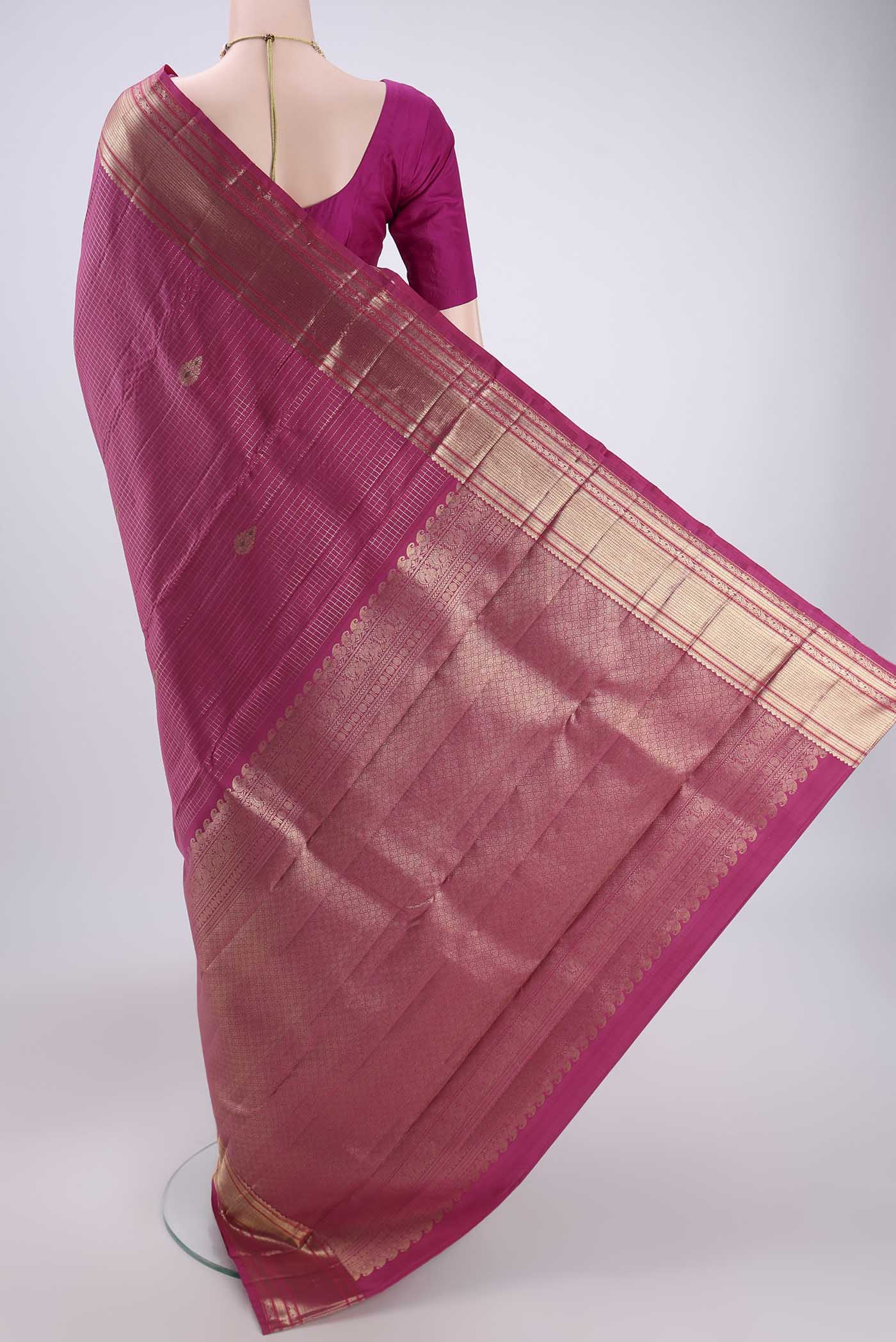 Flat view of Pink Kanjivaram Silk Saree with Checked design on the body and Zari And Thread Border. 