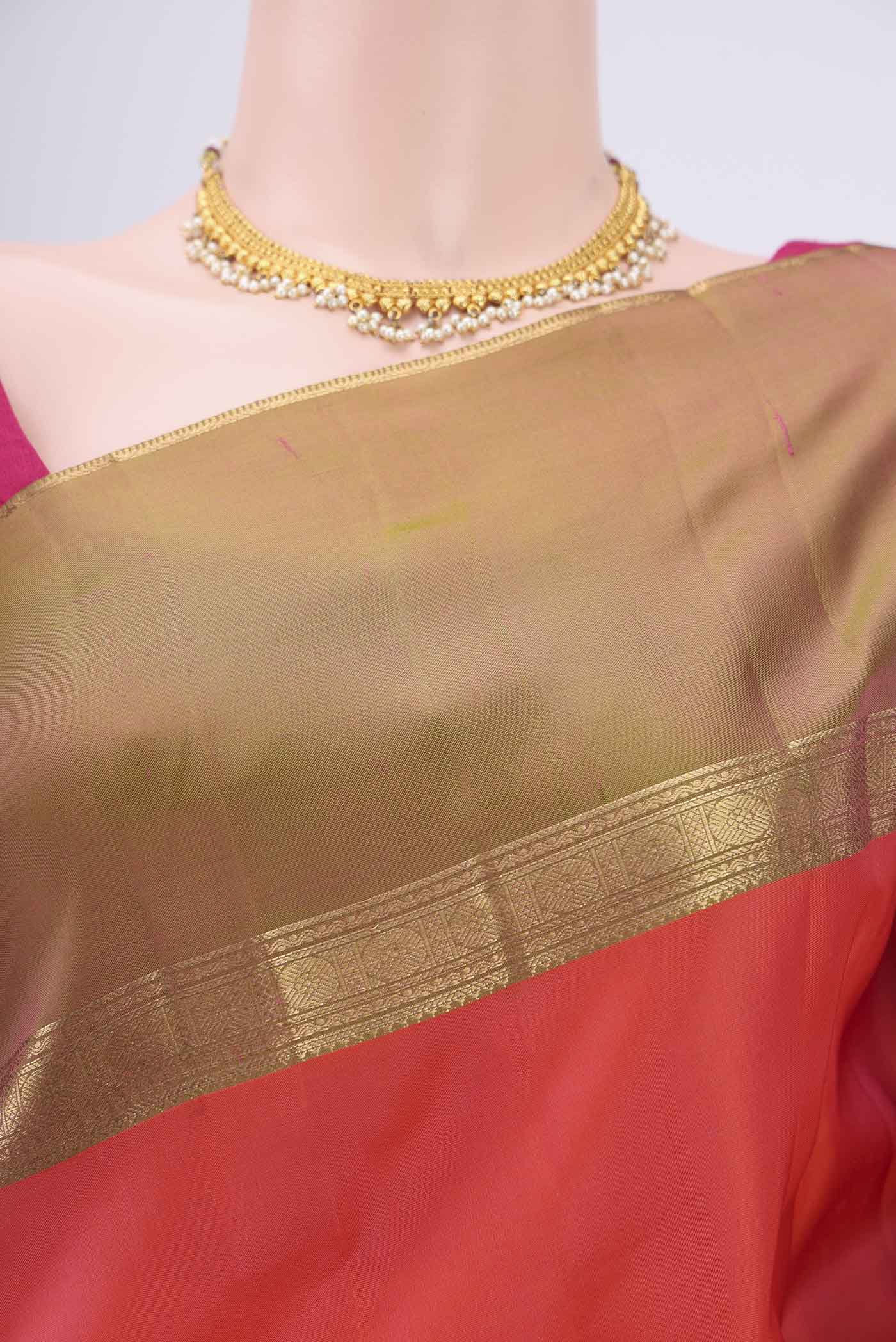 Border image of Orange Kanchipuram Silk Saree with Zari Butta on the body and Ganga Jamuna Border. 