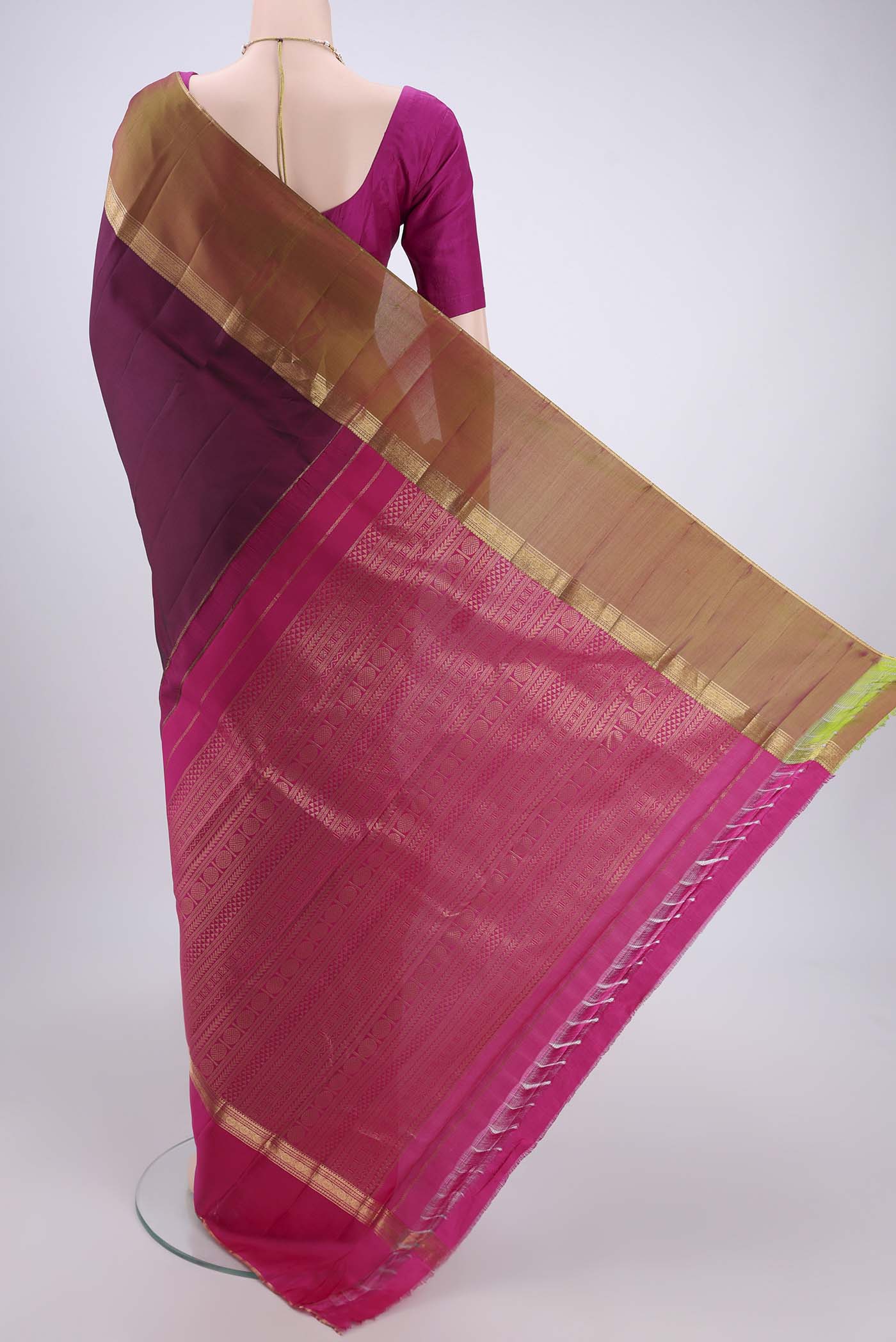 Flat view of Maroon Kanchipuram Silk Saree with Zari Butta on the body and Ganga Jamuna Border. 