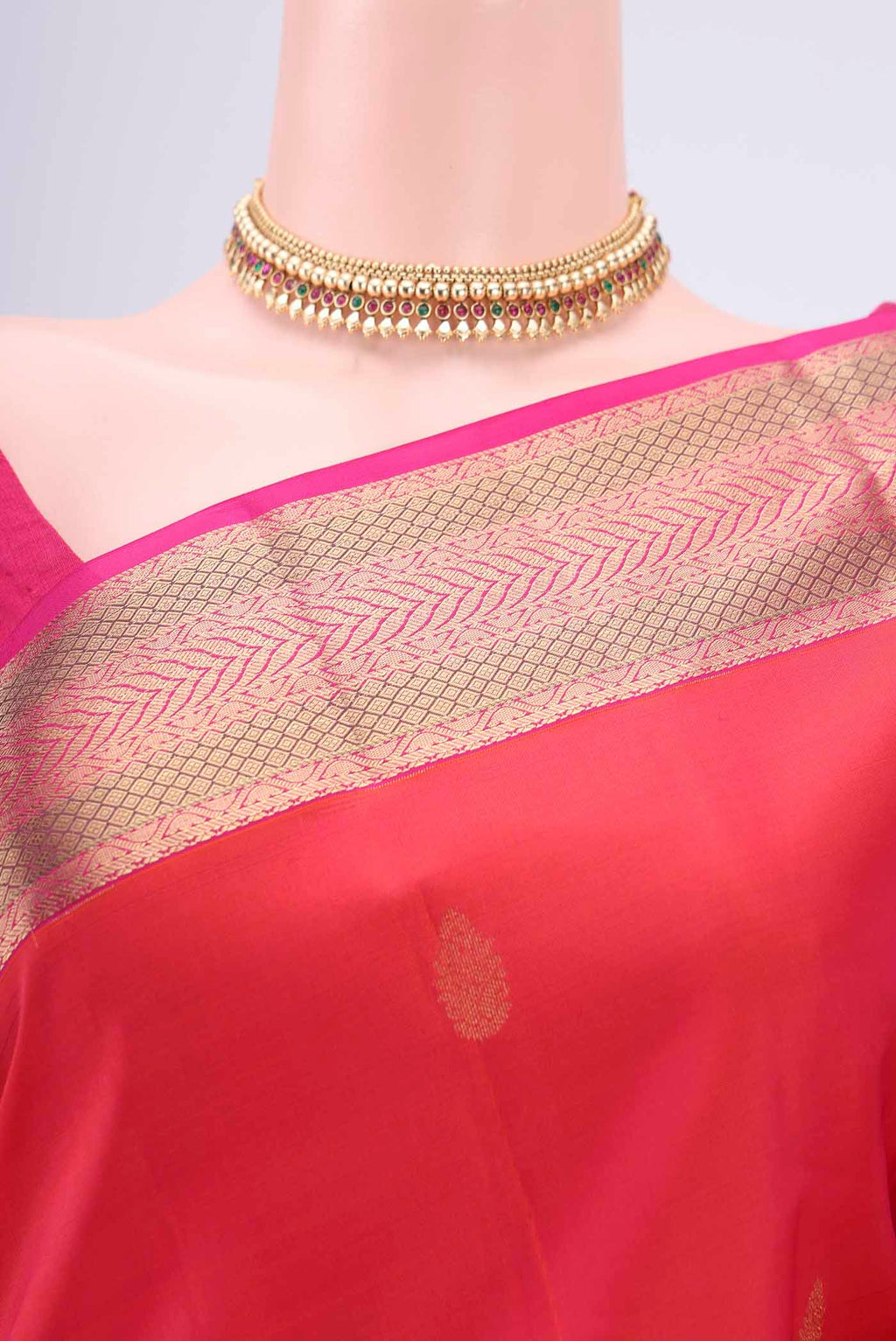 Border image of Orange Kanchipuram Silk Saree with Zari Butta on the body and Zari Border. 