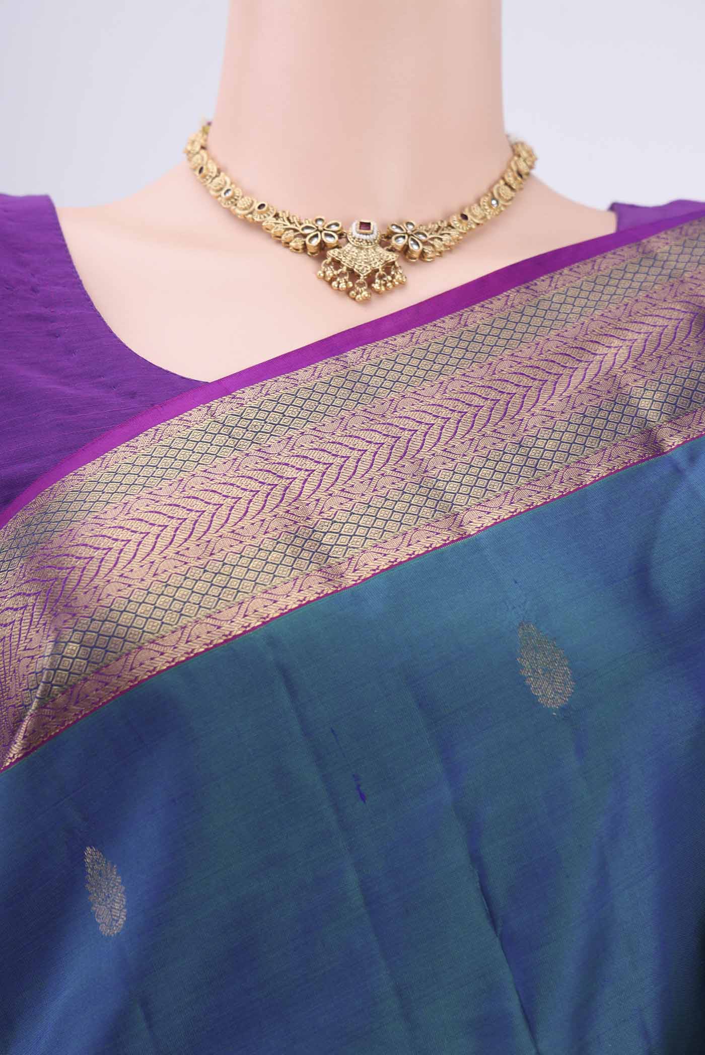 Border image of Peacock Blue Kanchipuram Silk Saree with Zari Butta on the body and Zari Border. 