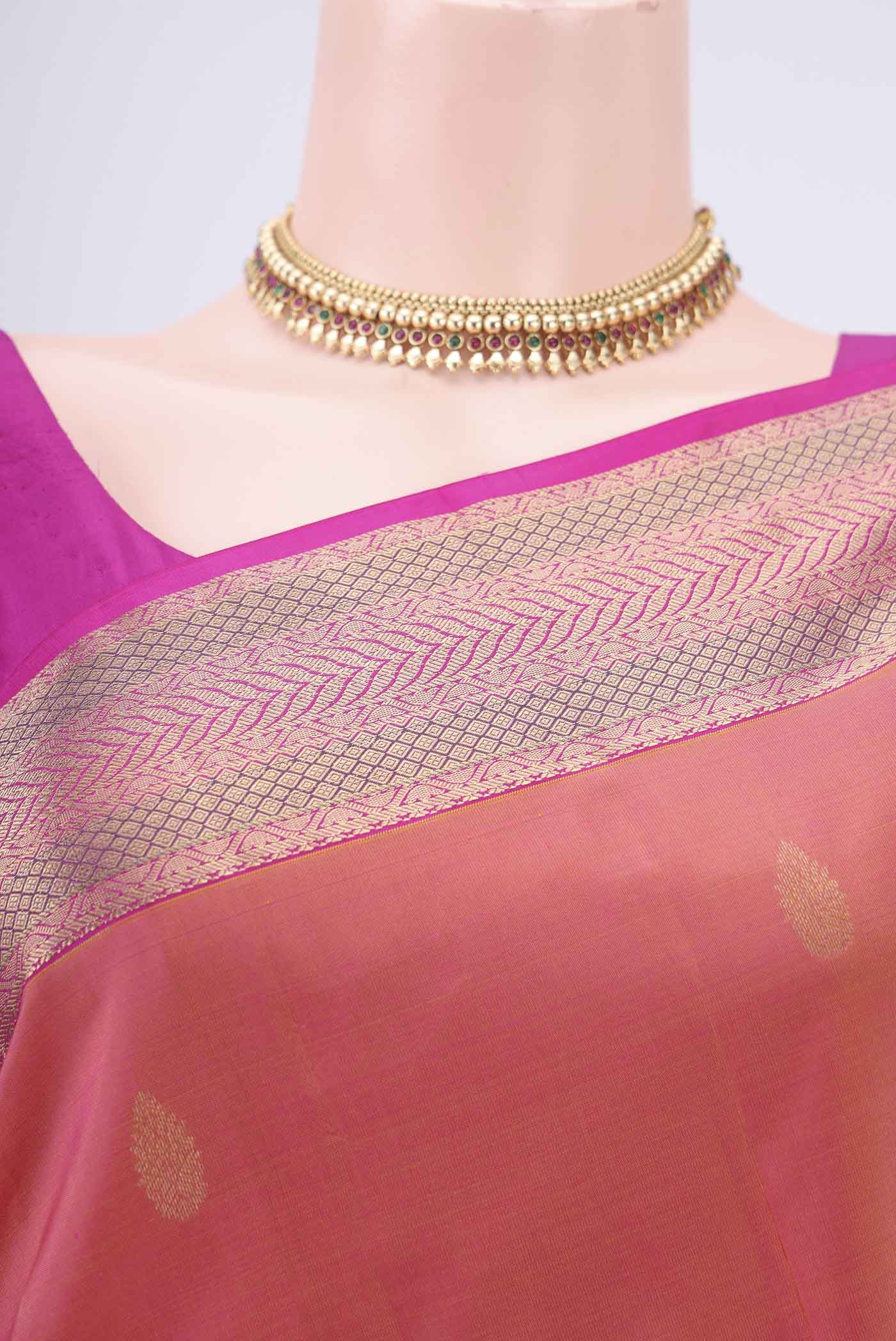 Border image of Orange Kanchipuram Silk Saree with Zari Butta on the body and Zari Border. 