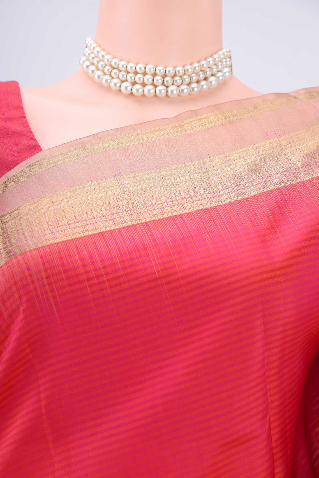 Border image of Peach Kanchipuram Silk Saree with Zari Butta on the body and Zari Border. 