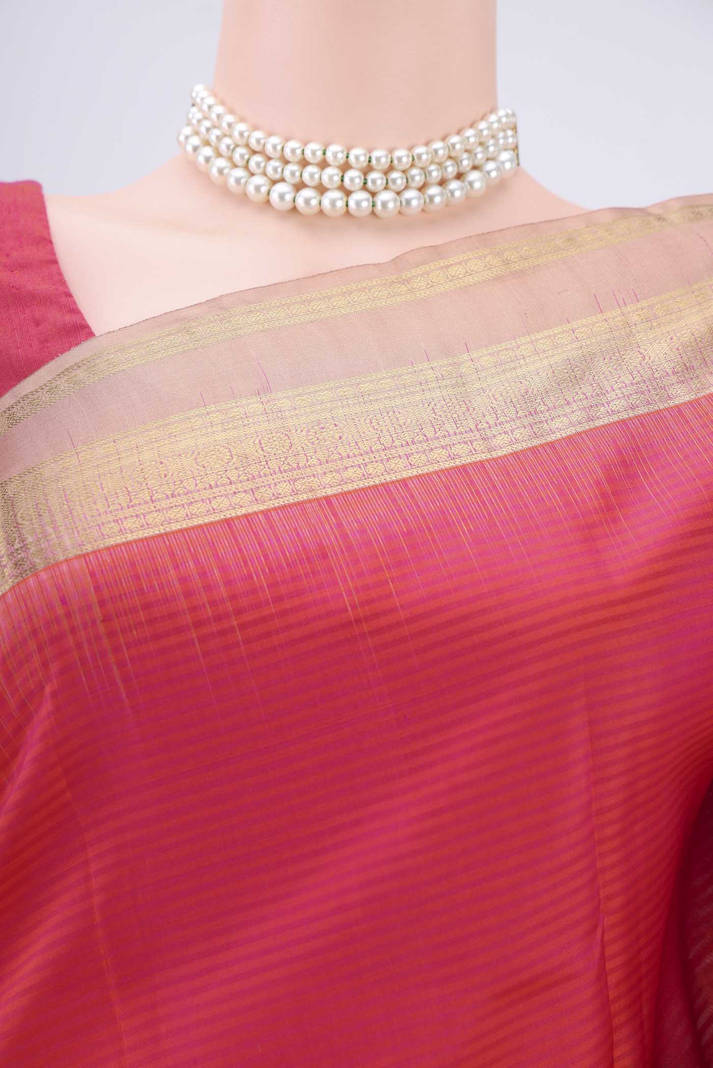 Border image of Peach Kanchipuram Silk Saree with Zari Butta on the body and Zari Border. 