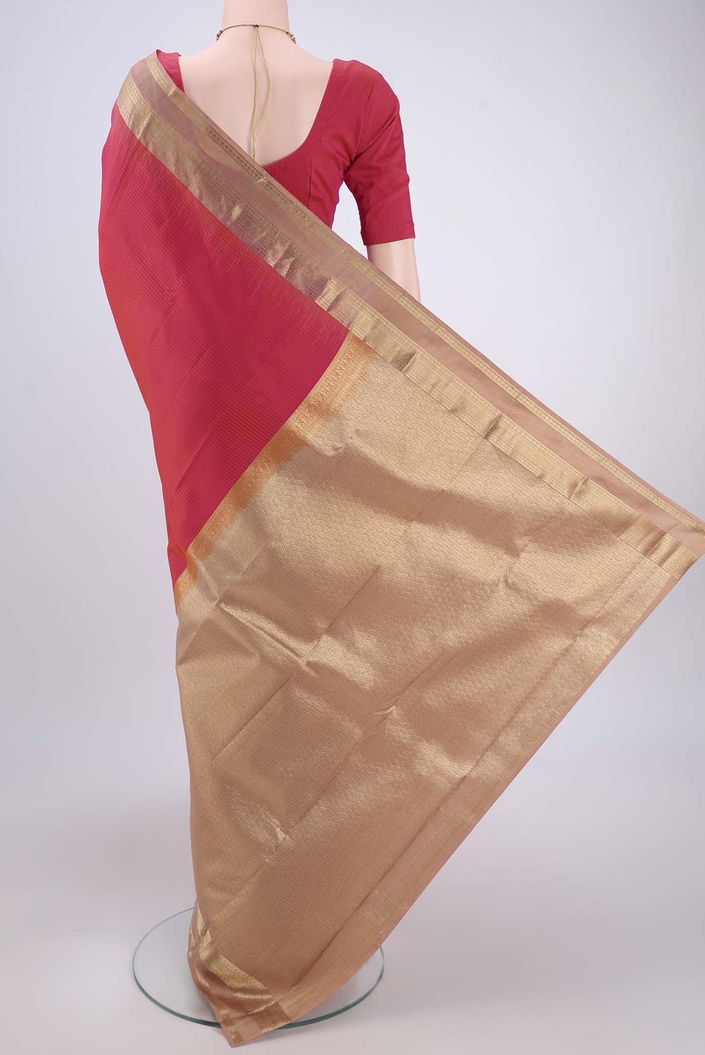 Flat view of Peach Kanchipuram Silk Saree with Zari Butta on the body and Zari Border. 