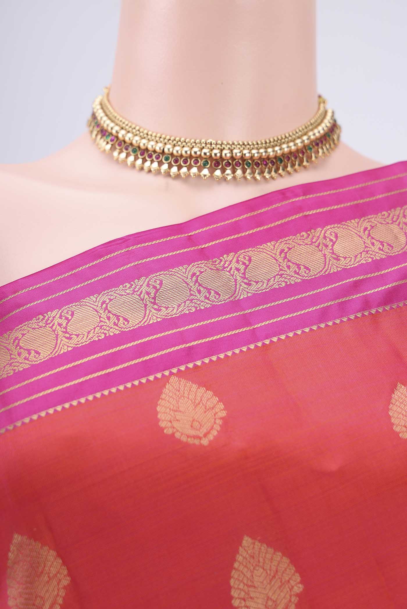 Border image of Orange Kanchipuram Silk Saree with Zari Butta on the body and Zari Border. 