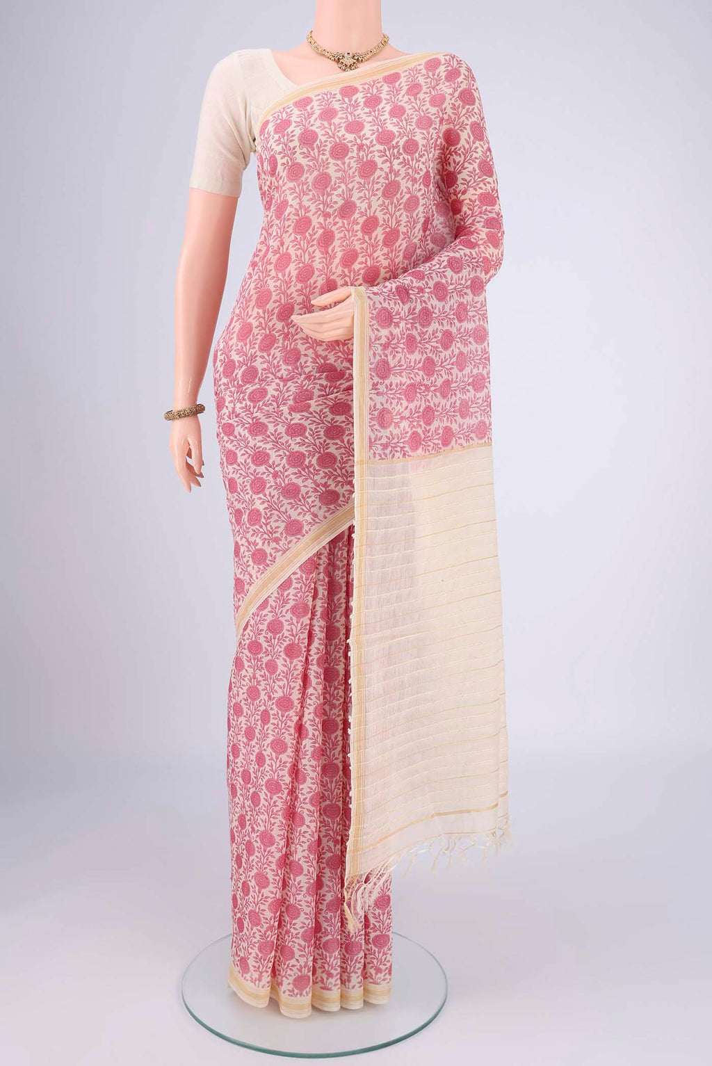 Off White Tussar Silk Saree with Floral Print on the body and Thread Border.  displayed on a mannequin
