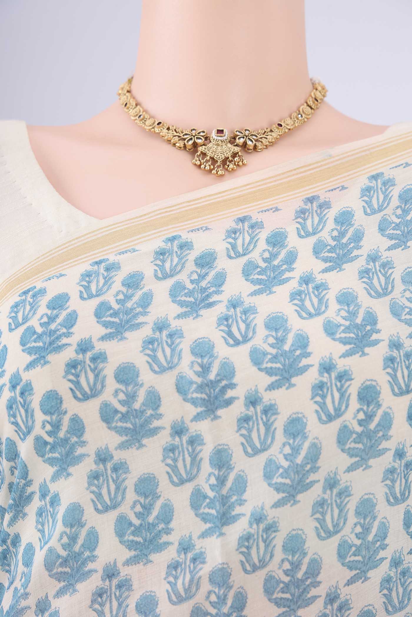 Border image of Off White Tussar Silk Saree with Floral Print on the body and Thread Border. 
