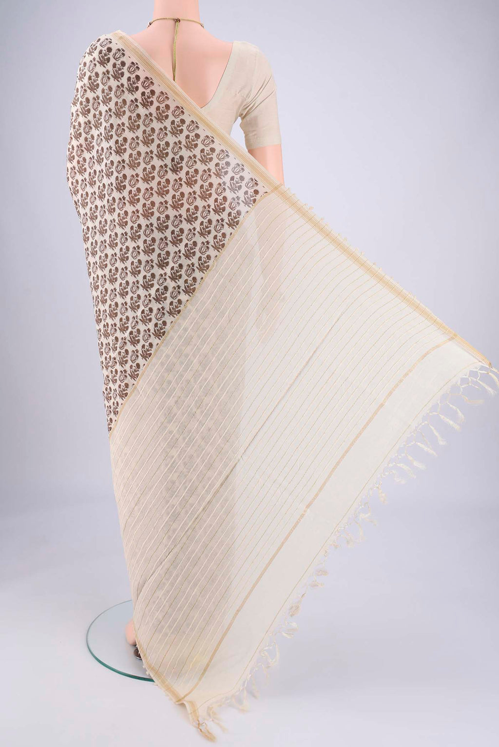 Flat view of Off White Tussar Silk Saree with Floral Print on the body and Thread Border. 