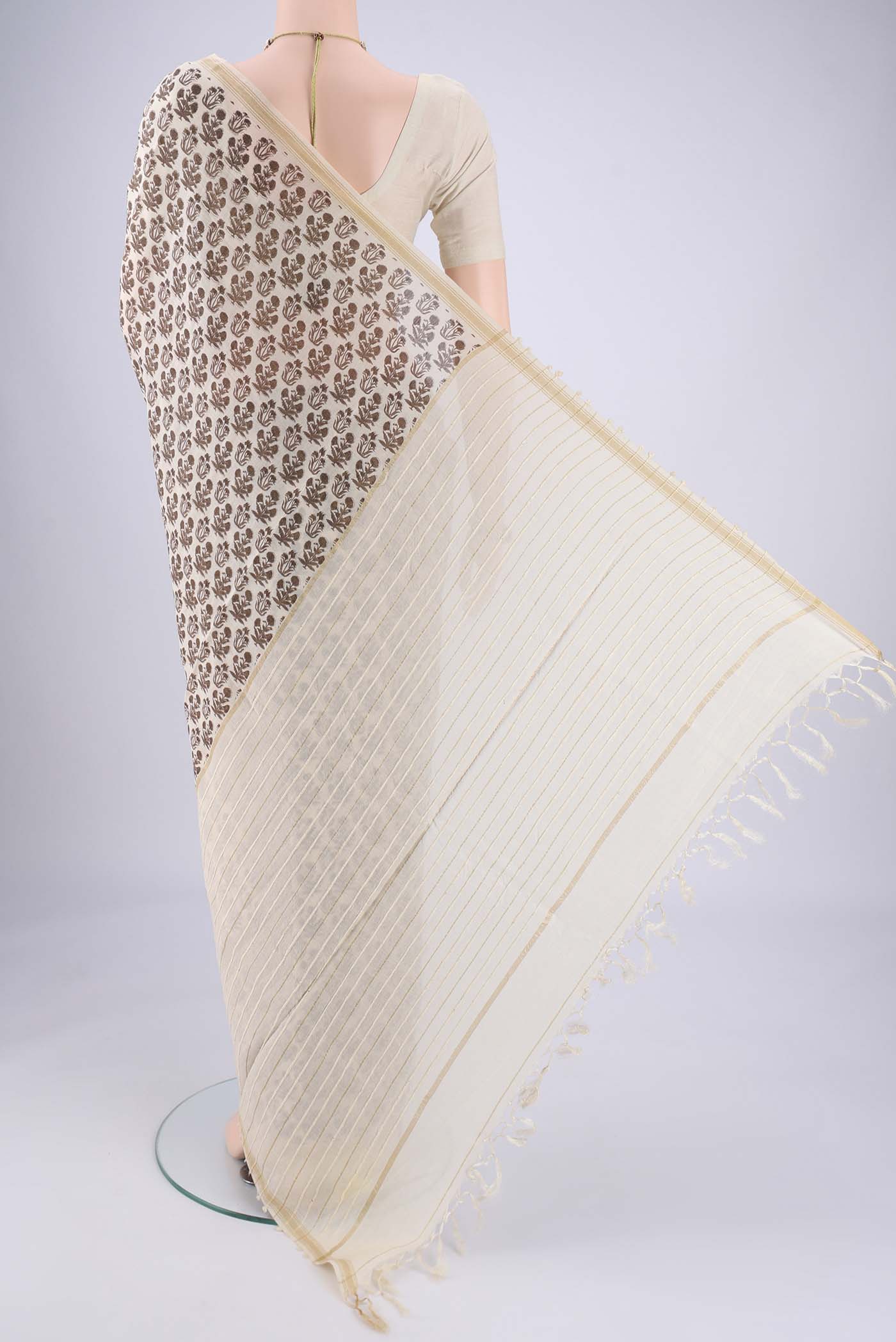 Flat view of Off White Tussar Silk Saree with Floral Print on the body and Thread Border. 