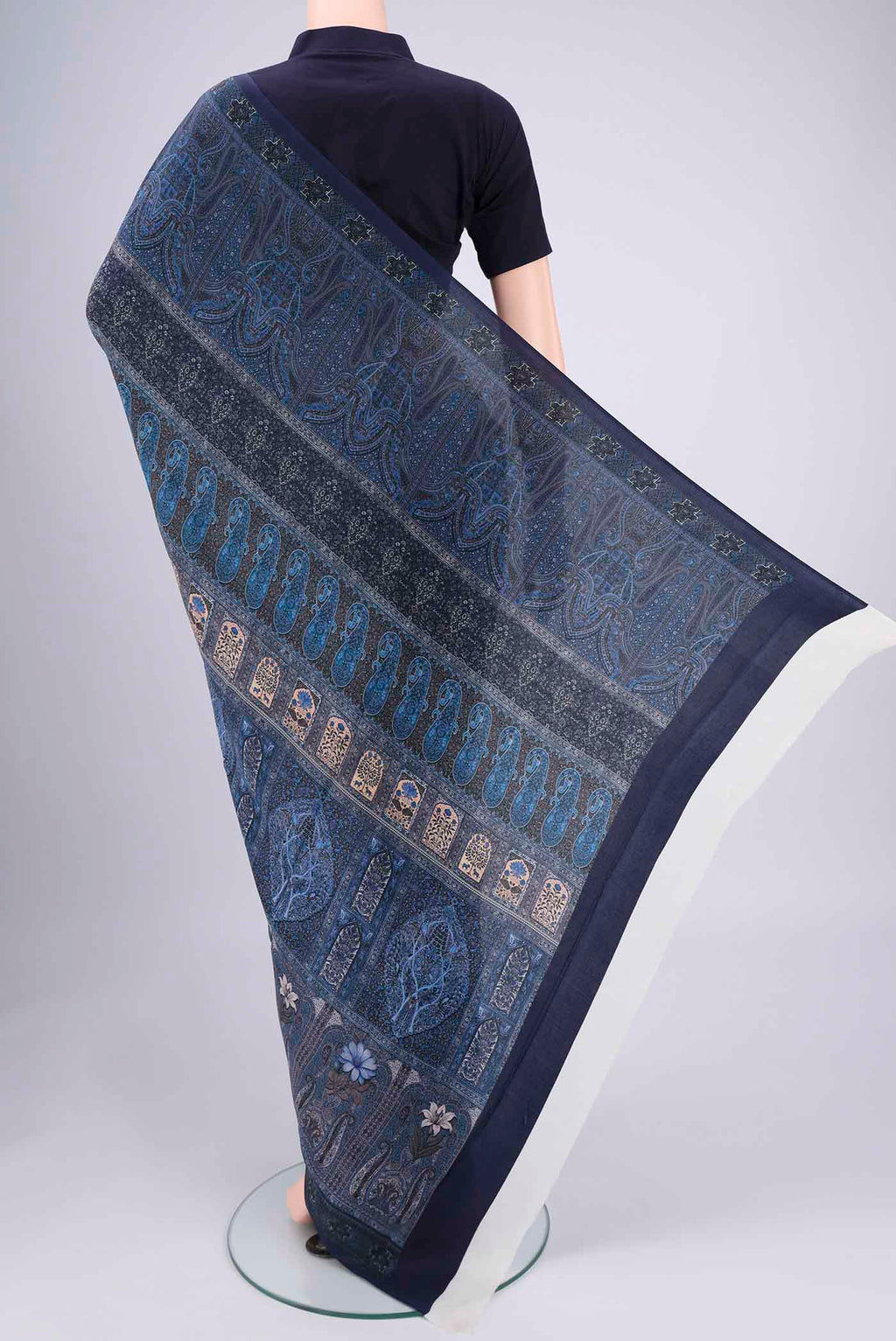 Flat view of Navy Blue Mysore Crepe Saree with Floral Print on the body and Zari Border. 