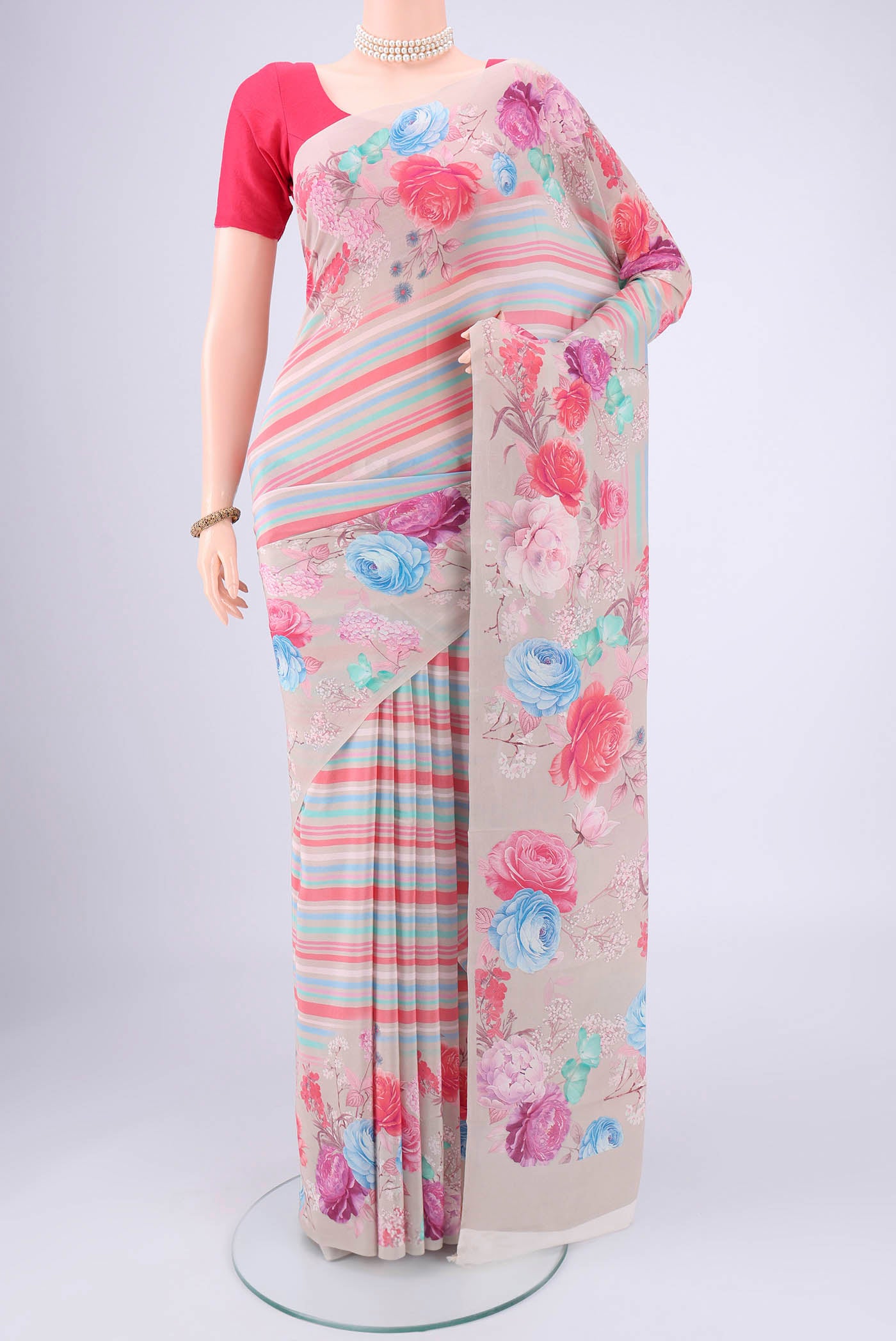 Grey Mysore Crepe Saree with Stripes on the body and Zari Border.  displayed on a mannequin