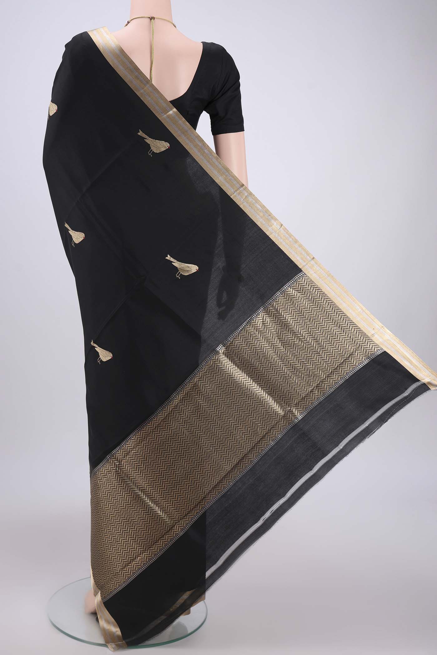 Flat view of Black Banarasi Katan Silk Saree with Zari Butta on the body and Zari Border. 