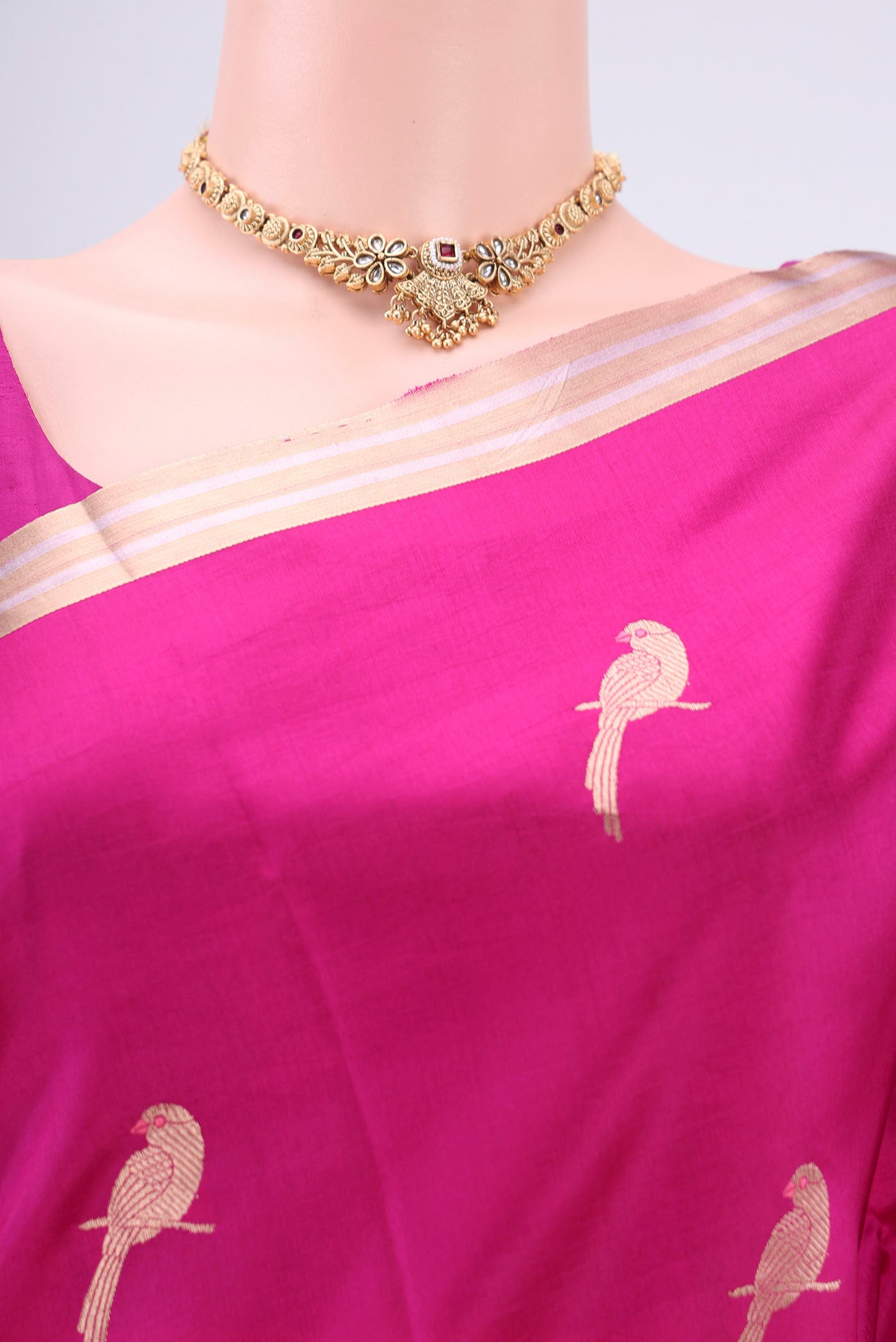 Border image of Rani Pink Banarasi Katan Silk Saree with Zari And Thread Butta on the body and Zari Border. 