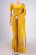 Lemon Yellow Banarasi Katan Silk Saree with Zari Butta on the body and Zari Border.  displayed on a mannequin