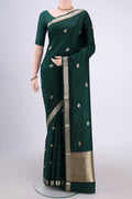 Bottle Green Banarasi Katan Silk Saree with Zari Butta on the body and Zari Border.  displayed on a mannequin