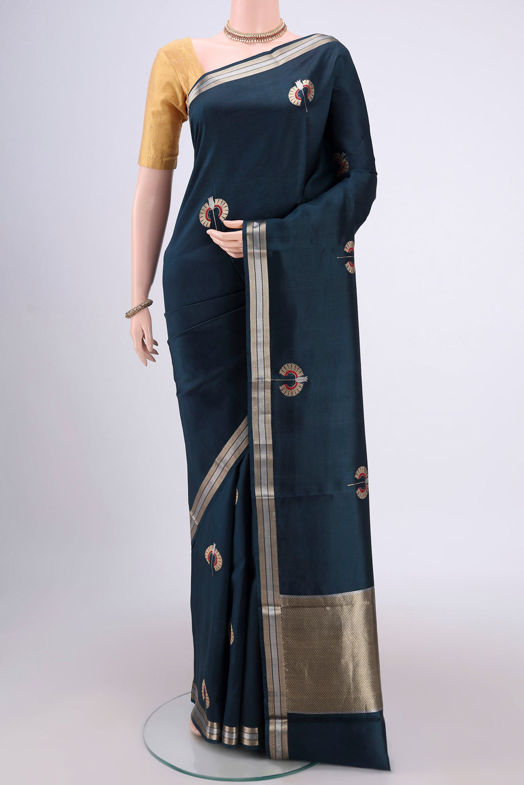 Navy Blue Banarasi Katan Silk Saree with Zari Butta on the body and Zari Border.  displayed on a mannequin