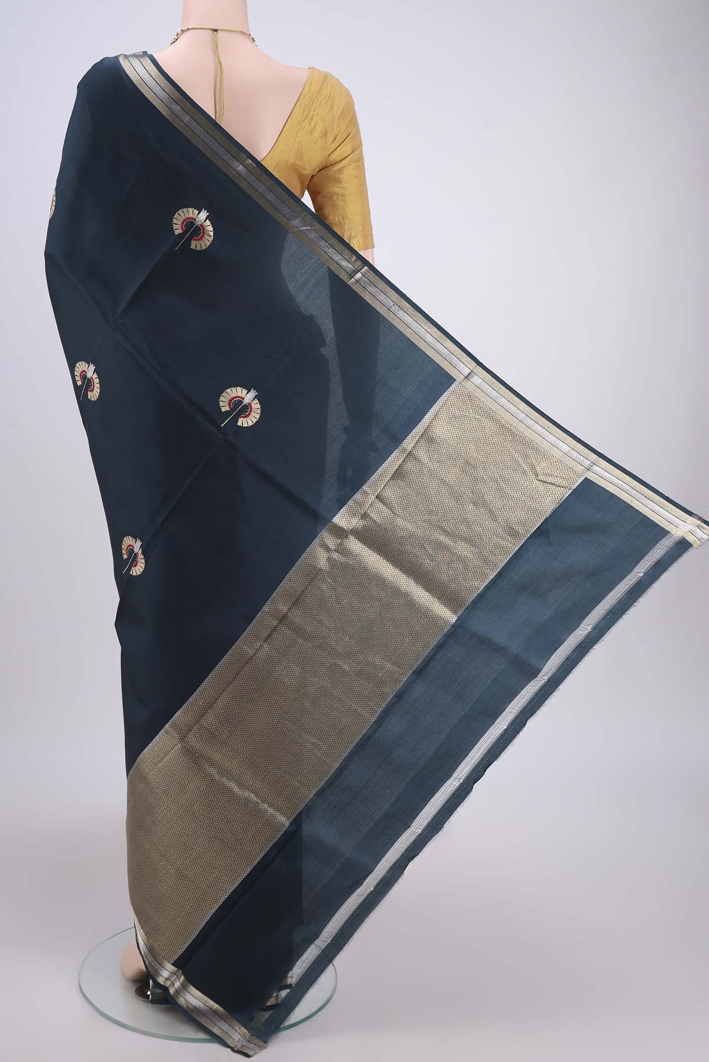 Flat view of Navy Blue Banarasi Katan Silk Saree with Zari Butta on the body and Zari Border. 