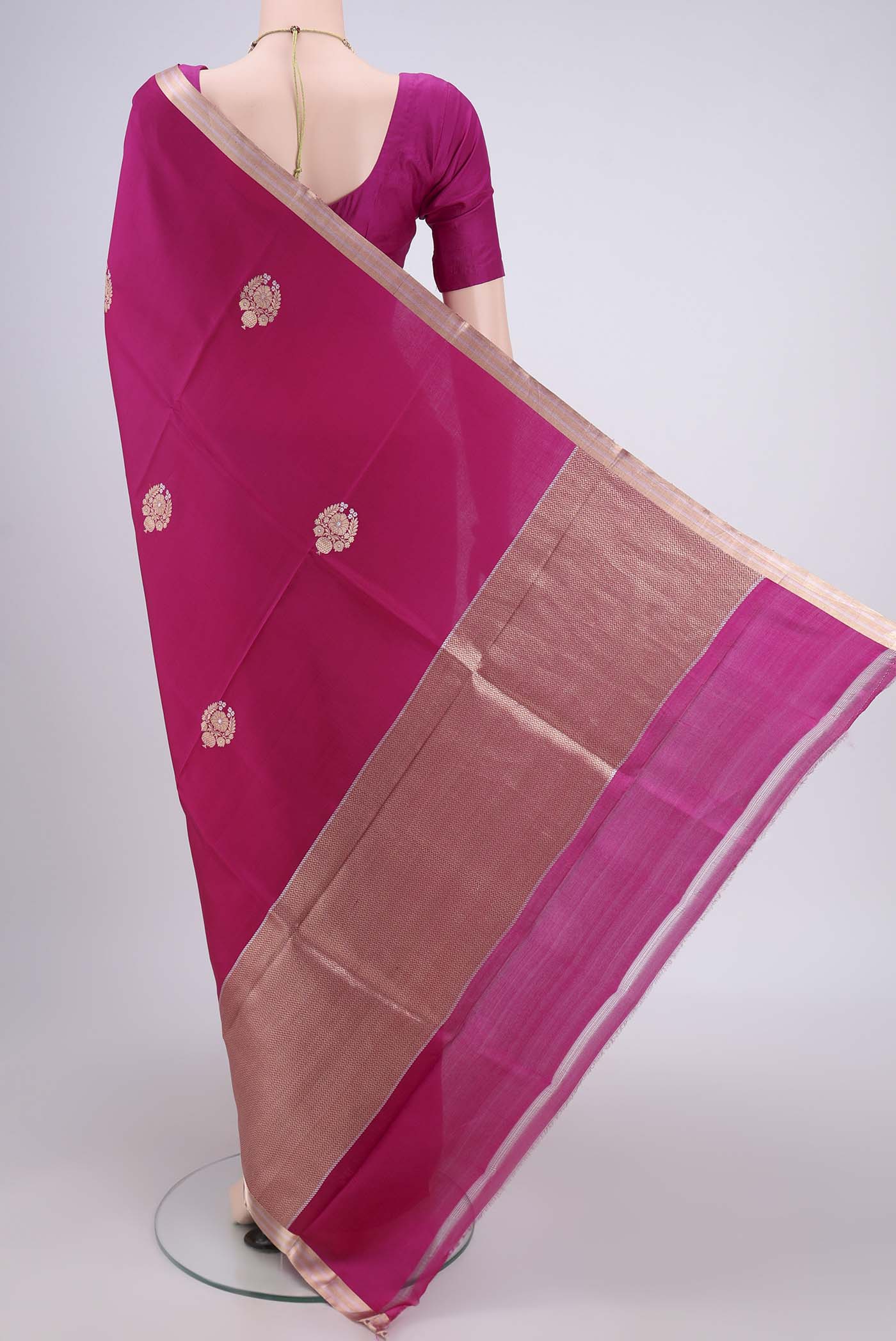 Flat view of Rani Pink Banarasi Katan Silk Saree with Zari Butta on the body and Zari Border. 