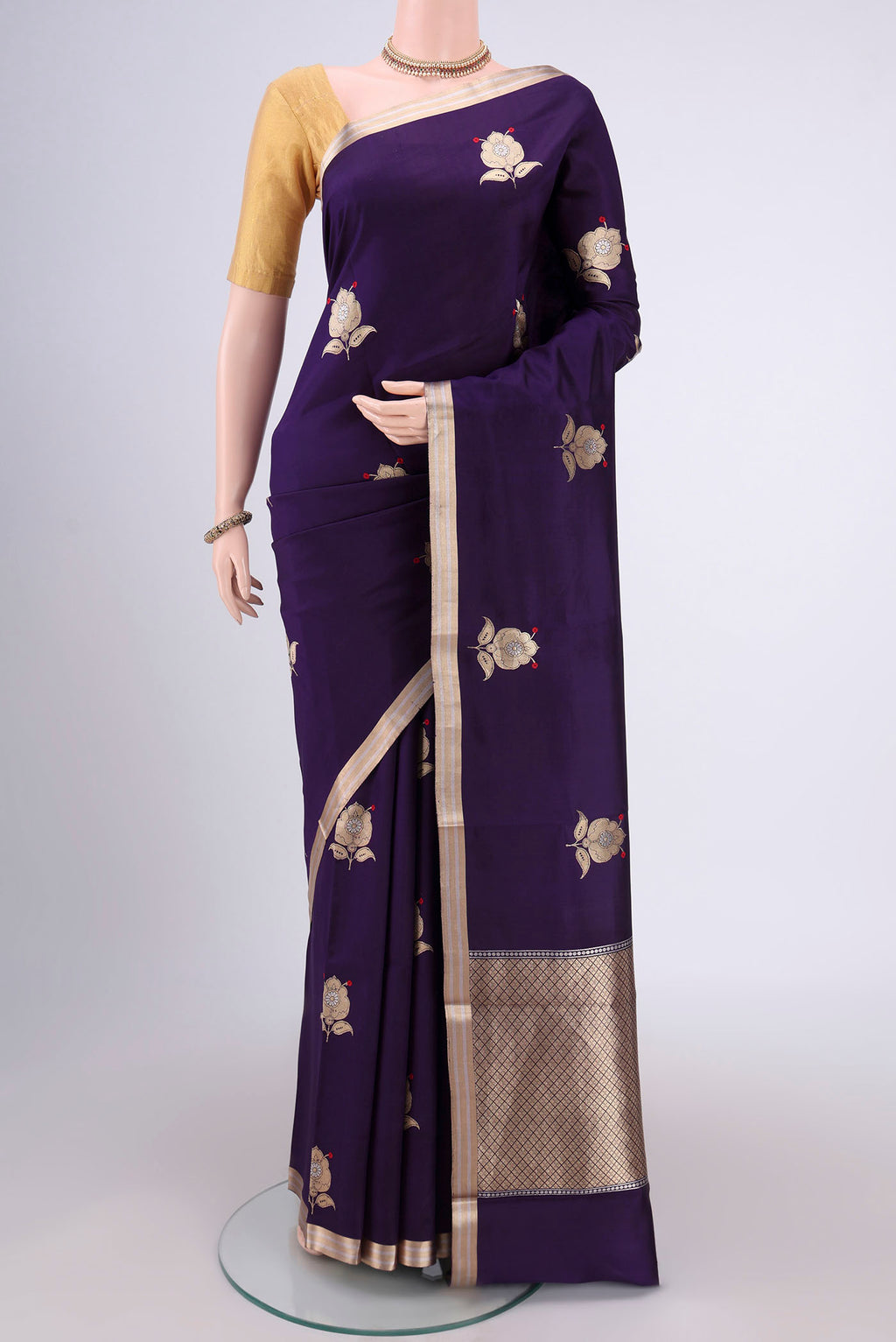 Purple Banarasi Katan Silk Saree with Zari Butta on the body and Zari Border.  displayed on a mannequin