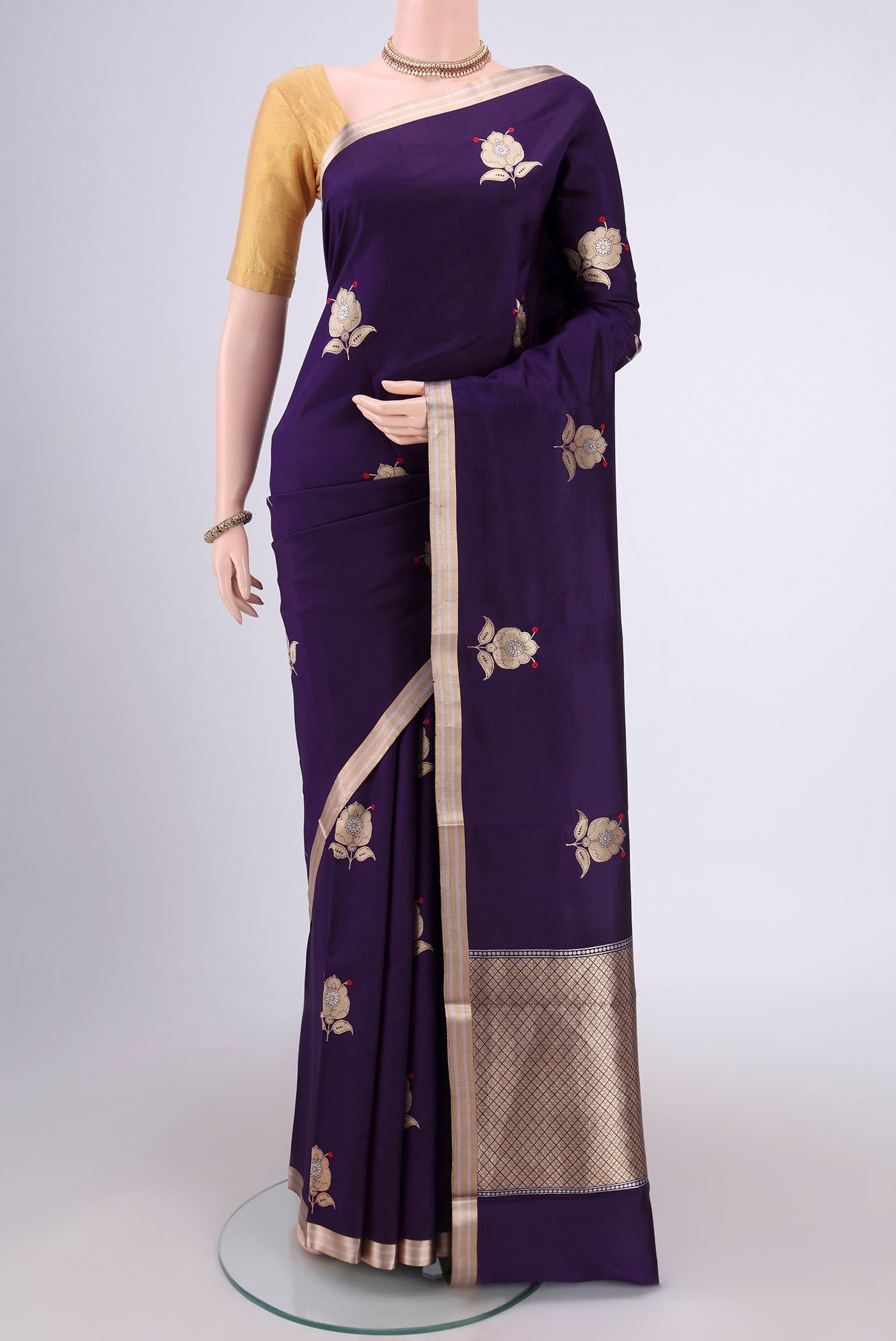 Purple Banarasi Katan Silk Saree with Zari Butta on the body and Zari Border.  displayed on a mannequin