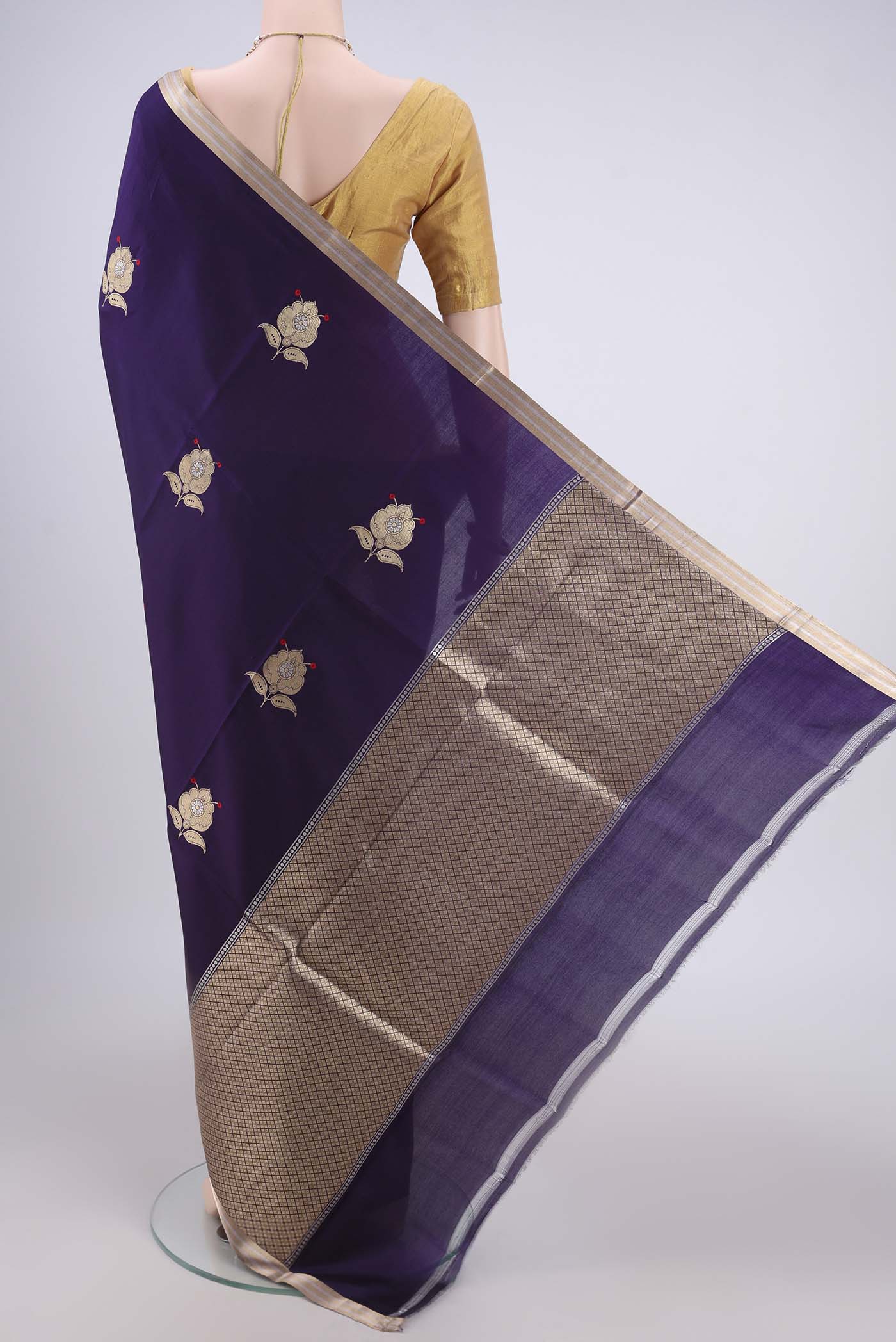 Flat view of Purple Banarasi Katan Silk Saree with Zari Butta on the body and Zari Border. 