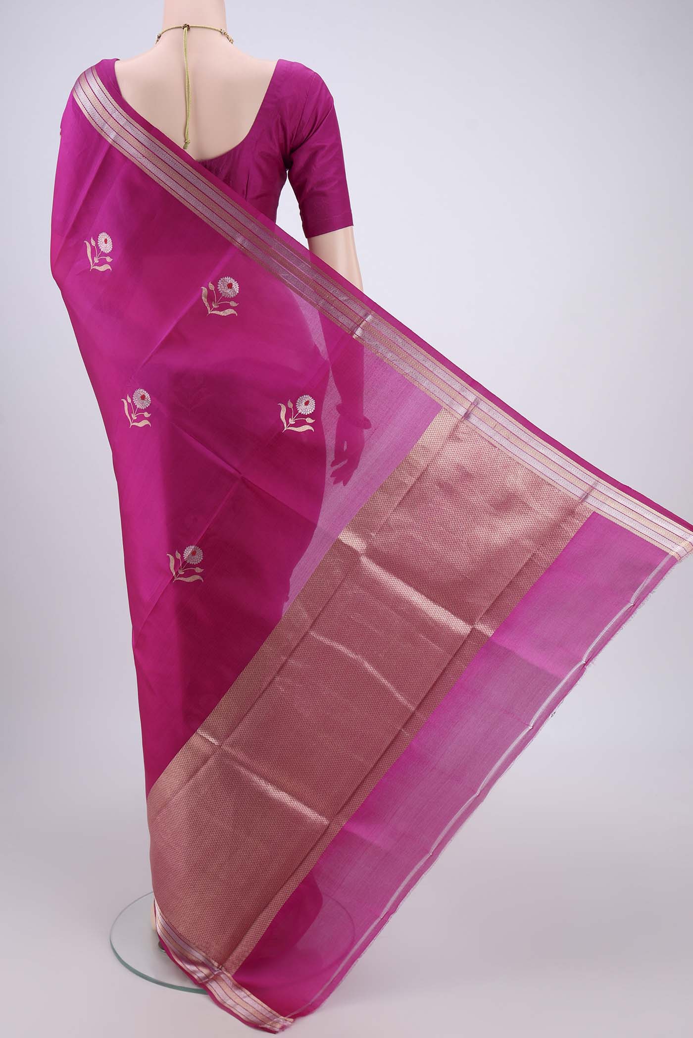 Flat view of Rani Pink Banarasi Katan Silk Saree with Zari And Thread Butta on the body and Zari Border. 