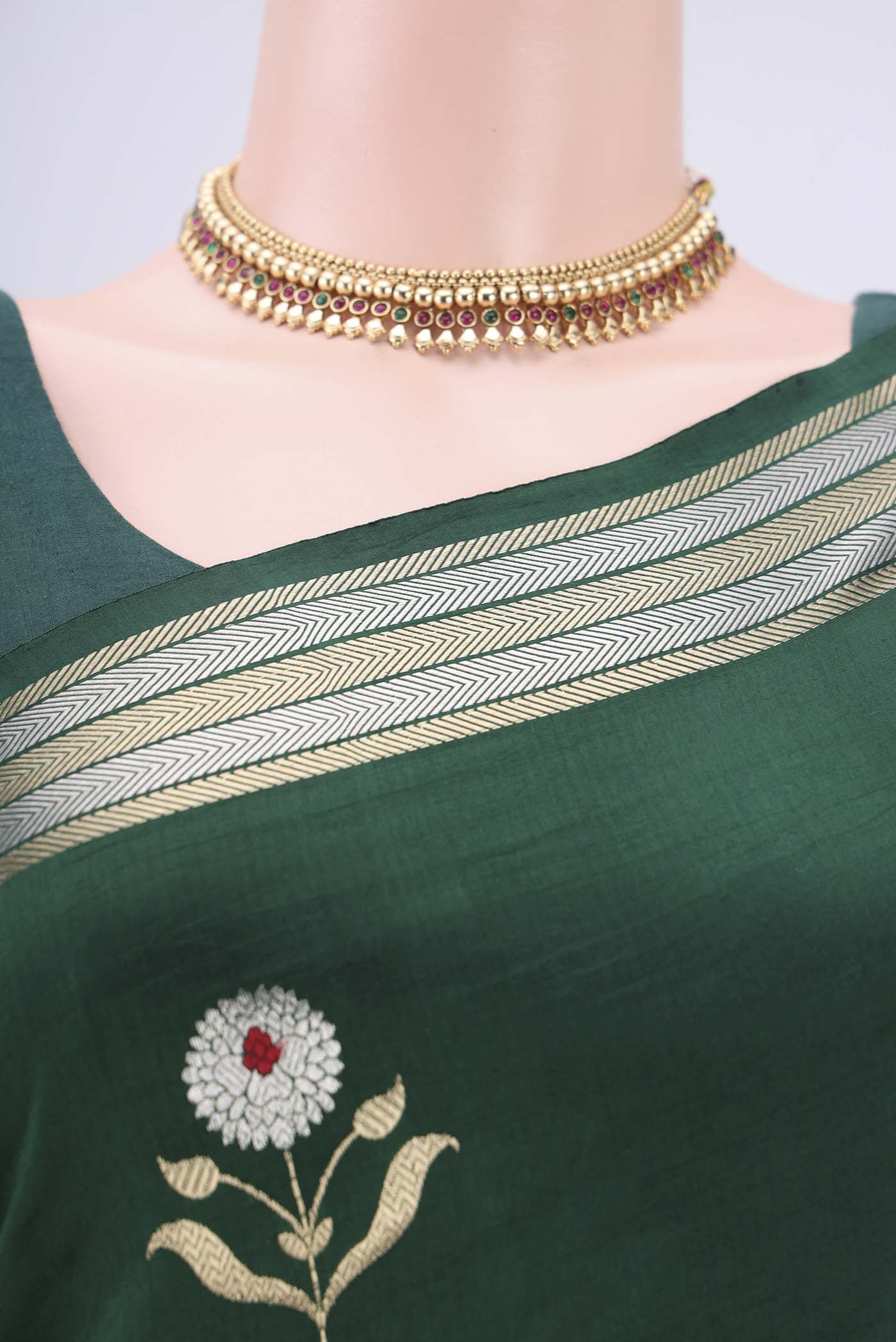 Border image of Bottle Green Banarasi Katan Silk Saree with Zari And Thread Butta on the body and Zari Border. 
