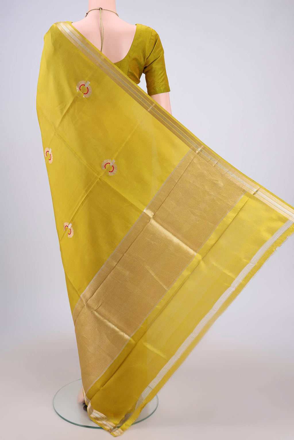 Flat view of Light Green Banarasi Katan Silk Saree with Zari Butta on the body and Zari Border. 