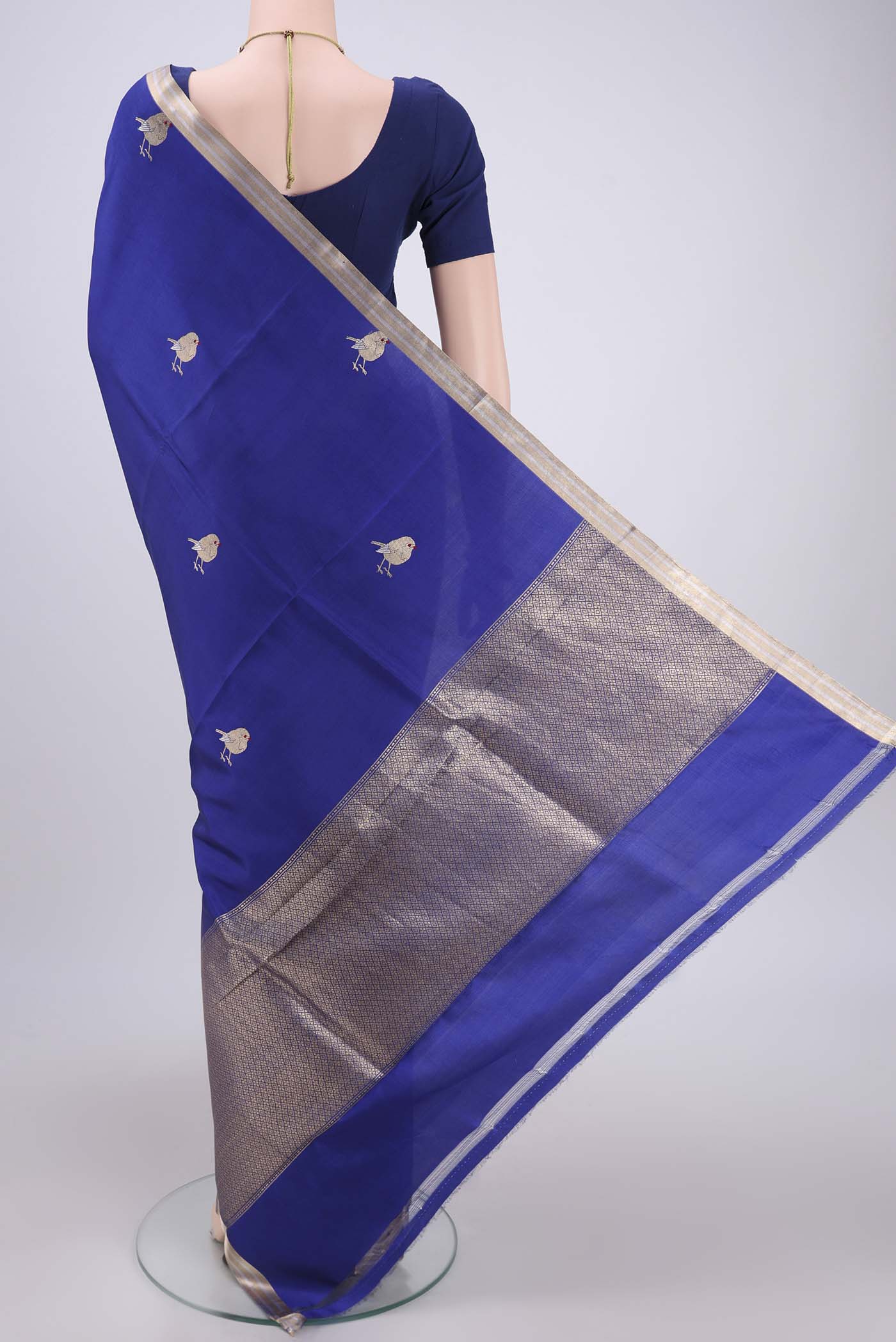 Flat view of Royal Blue Banarasi Katan Silk Saree with Zari Butta on the body and Zari Border. 
