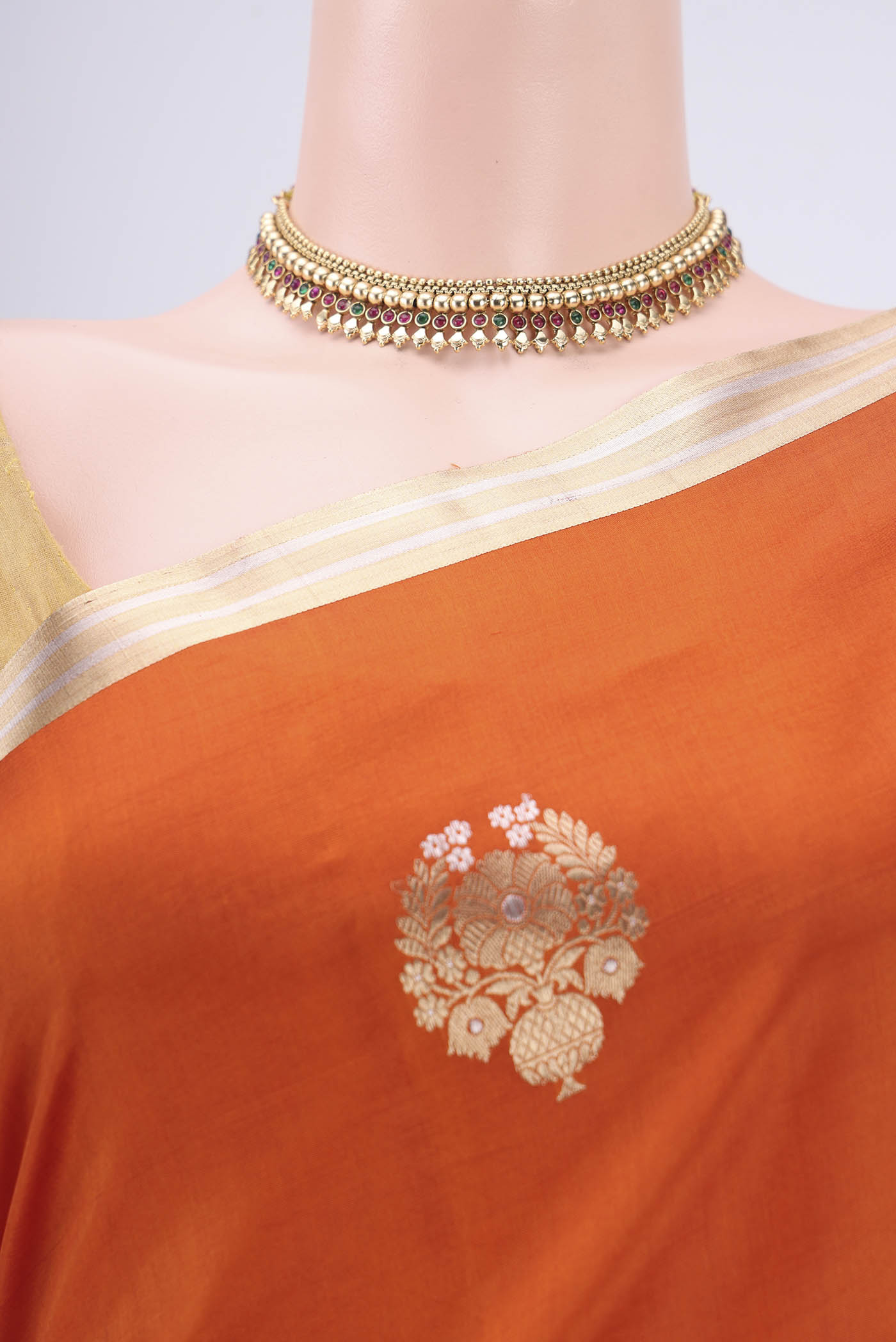 Border image of Rust Banarasi Katan Silk Saree with Zari Butta on the body and Zari Border. 