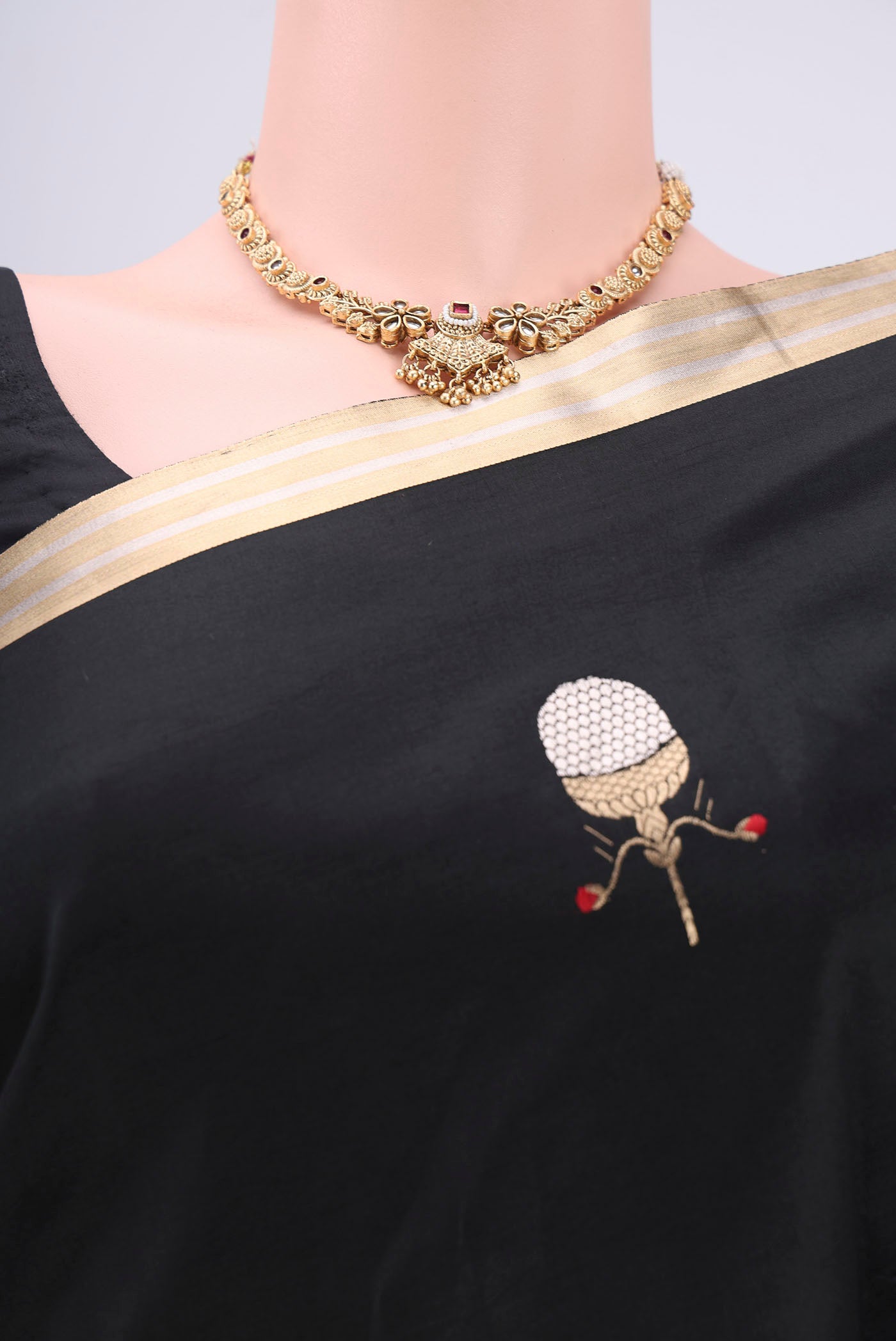 Border image of Black Banarasi Katan Silk Saree with Zari Butta on the body and Zari Border. 