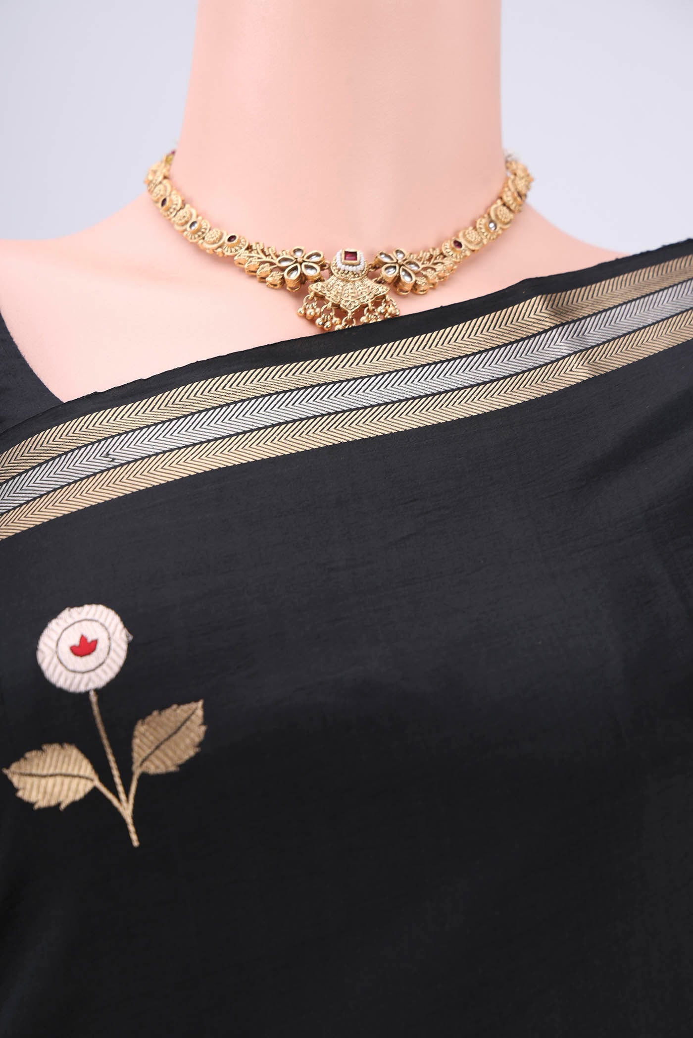 Border image of Black Banarasi Katan Silk Saree with Zari And Thread Butta on the body and Zari Border. 