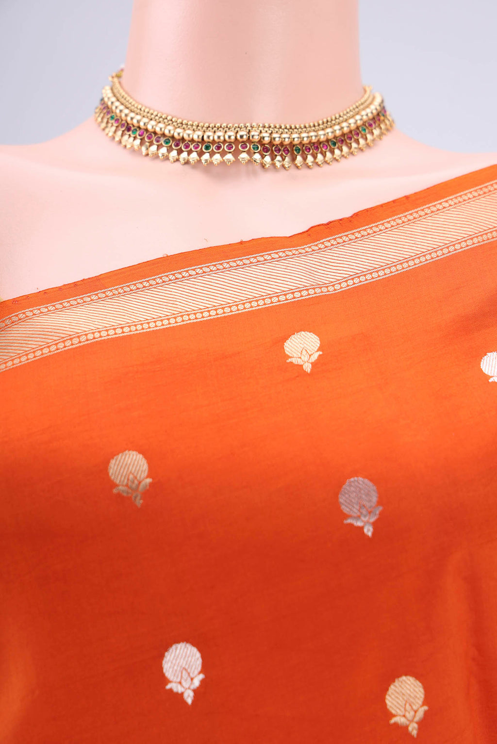 Border image of Rust Banarasi Katan Silk Saree with Zari Butta on the body and Zari Border. 